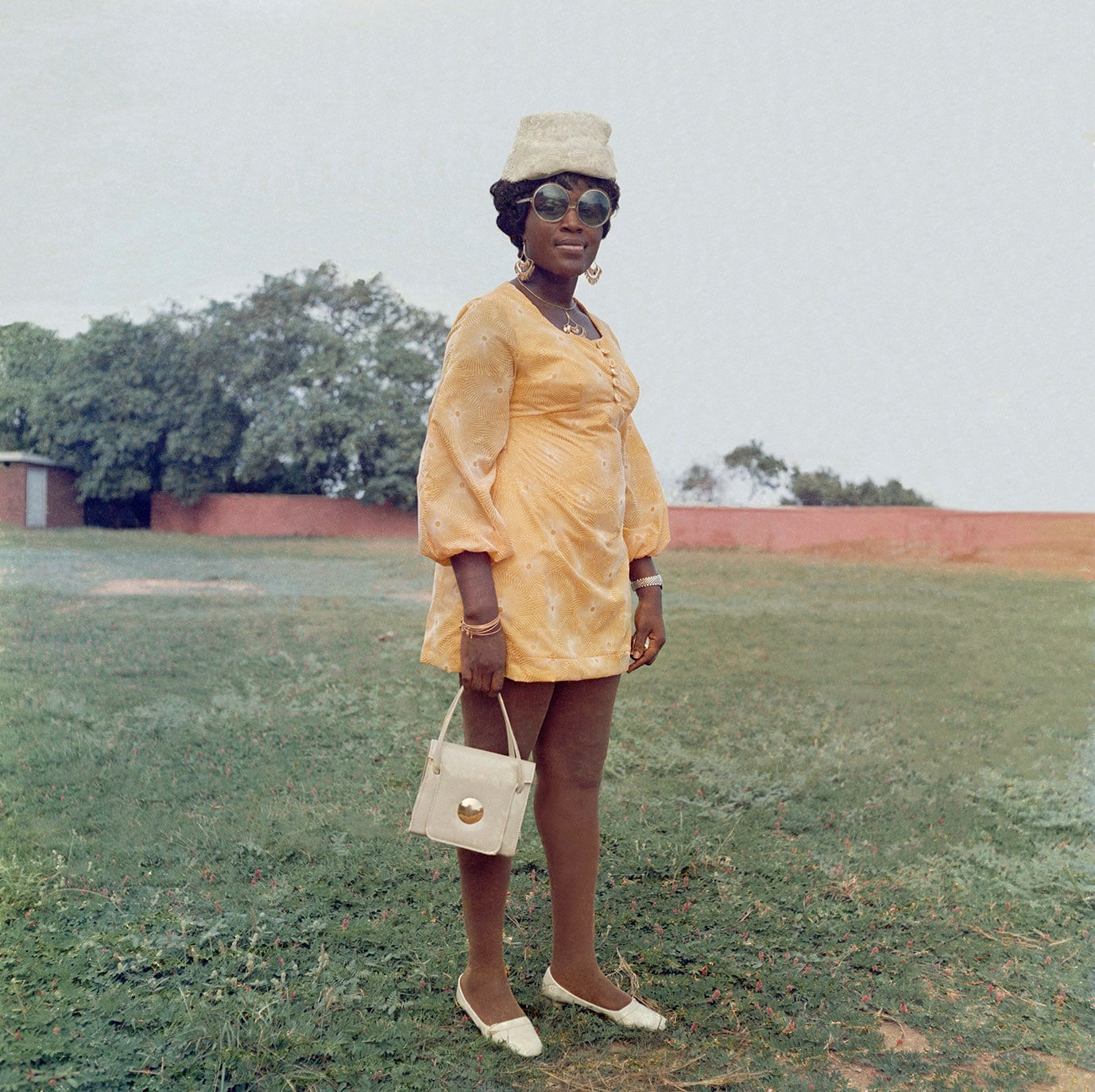 James Barnor, A wedding guest in the park behind the Holy Trinity Cathedral, Accra, c. 1971