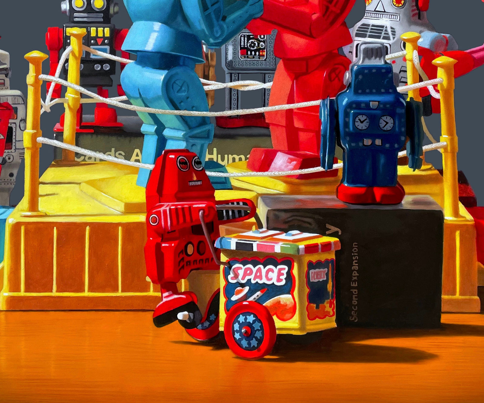 Center detail of Rock-em Sock-em robots fight with other robot toys watching