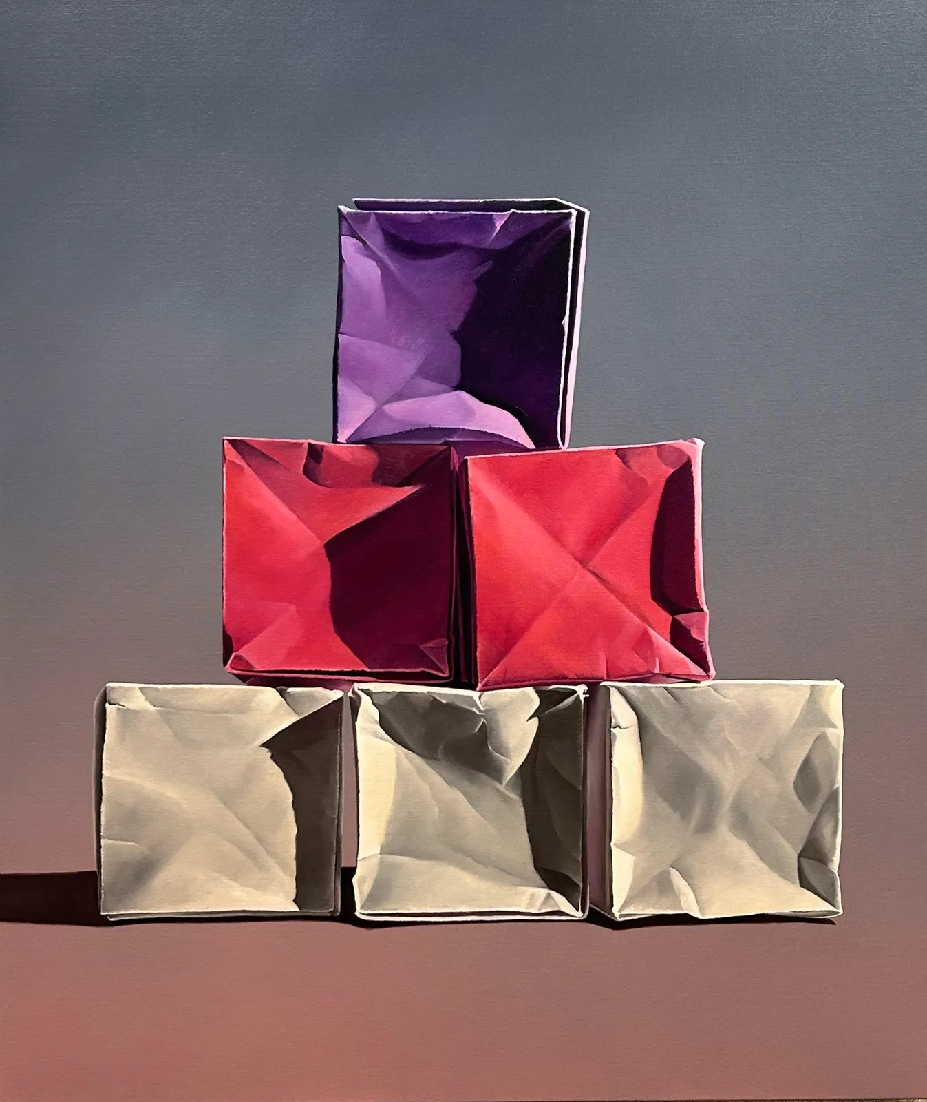 Colorful paper box pyramid on a warm background