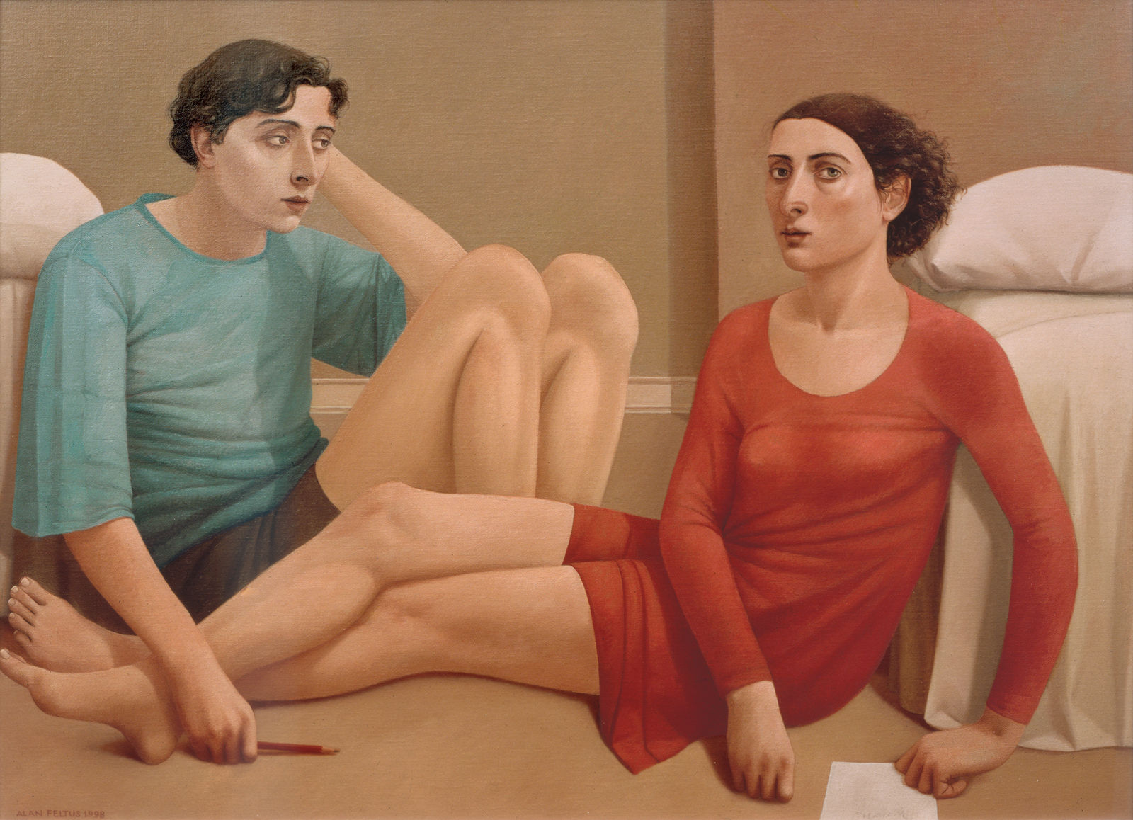 Man in a blue shirt and a woman in a red dress sitting on a bedroom floor