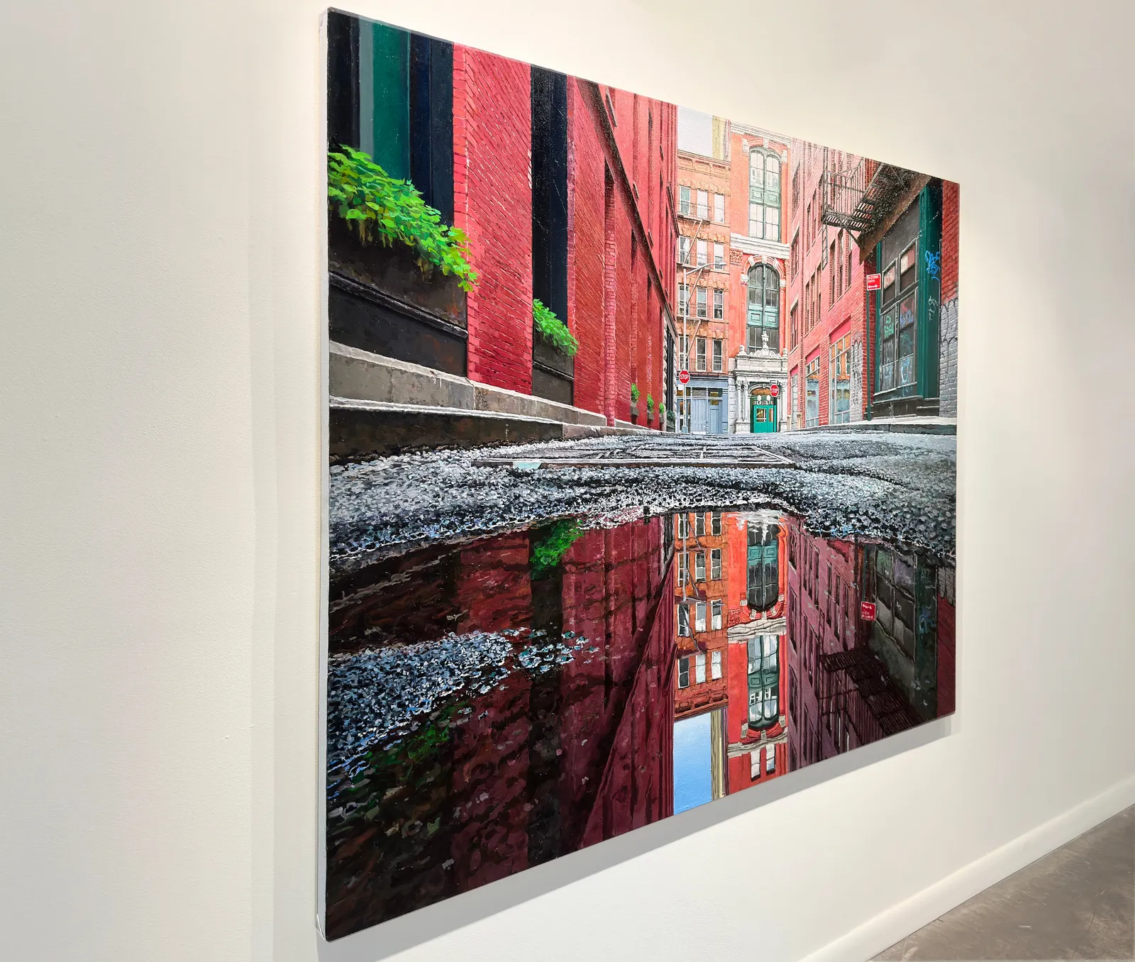 low viewpoint of a puddle on a narrow Tribeca Street