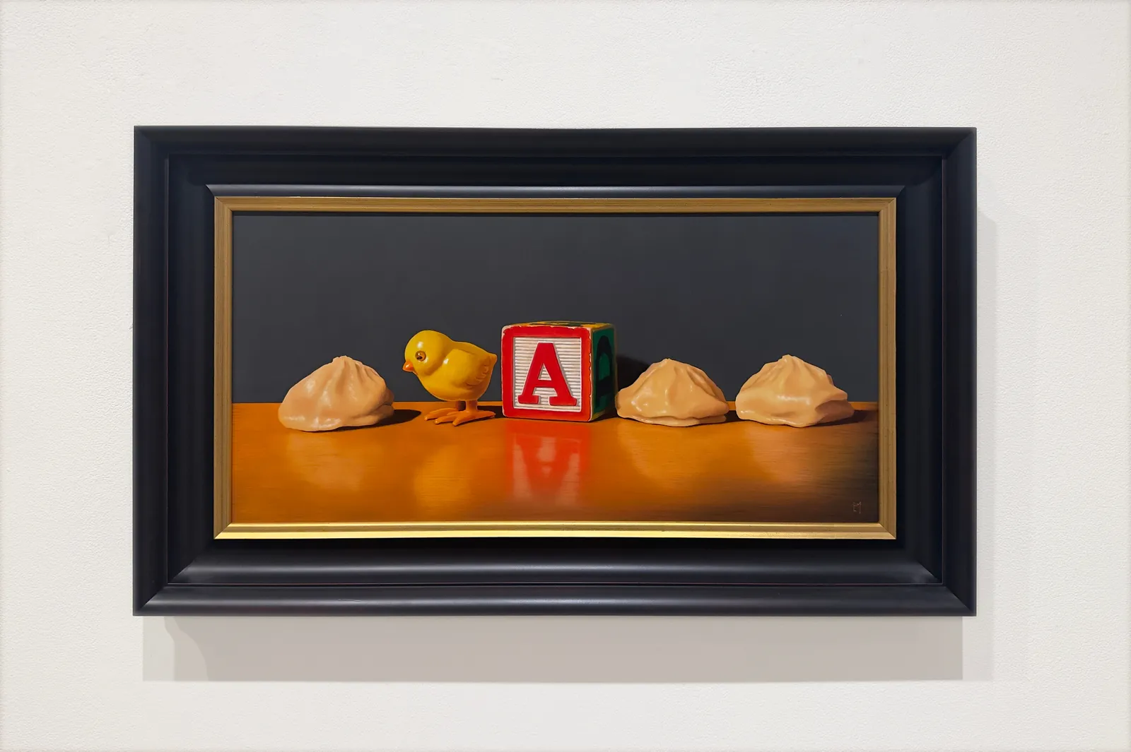 Painting of dumplings, a toy chick, and a letter block