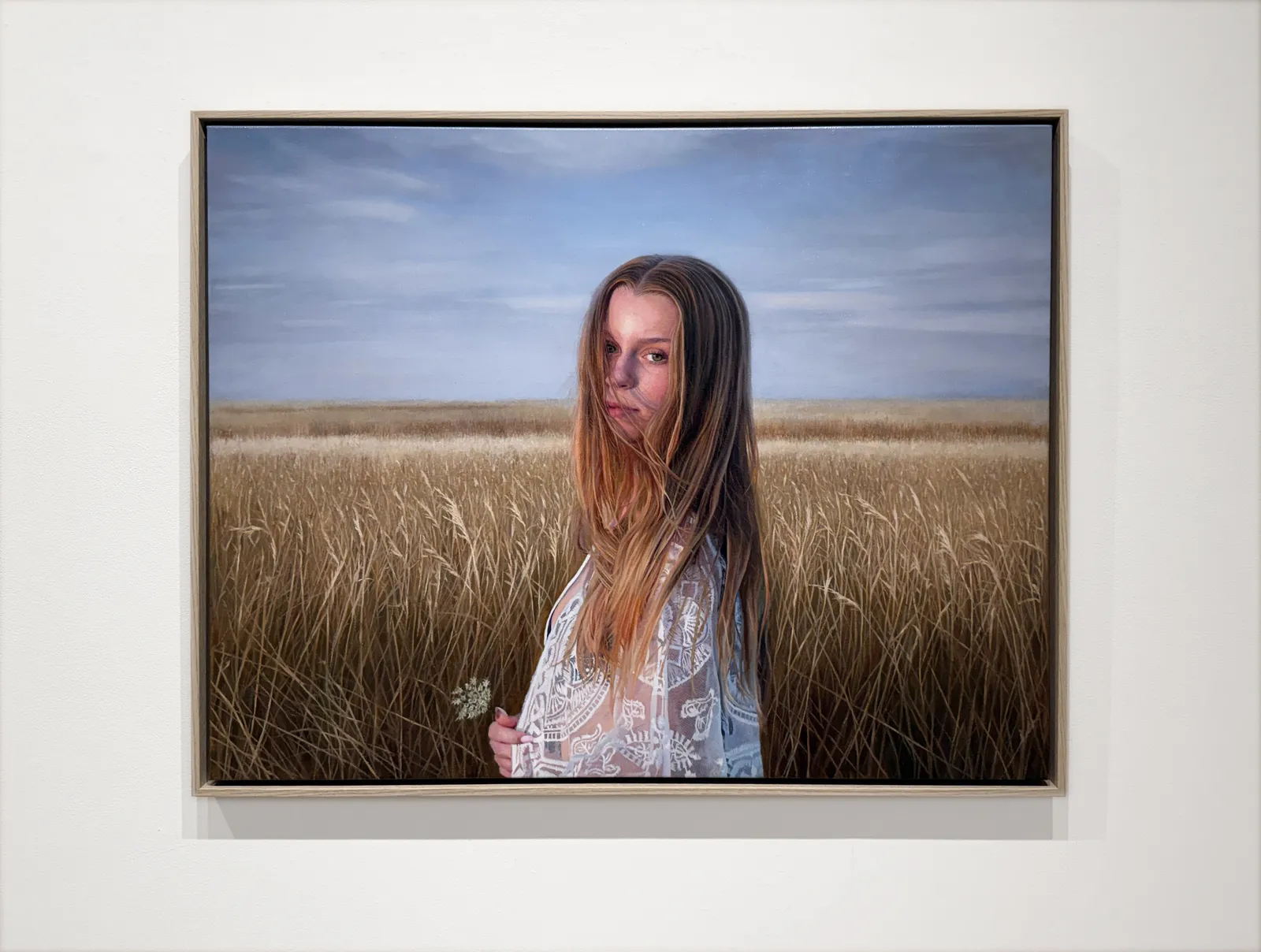 Painting of a girl in a field