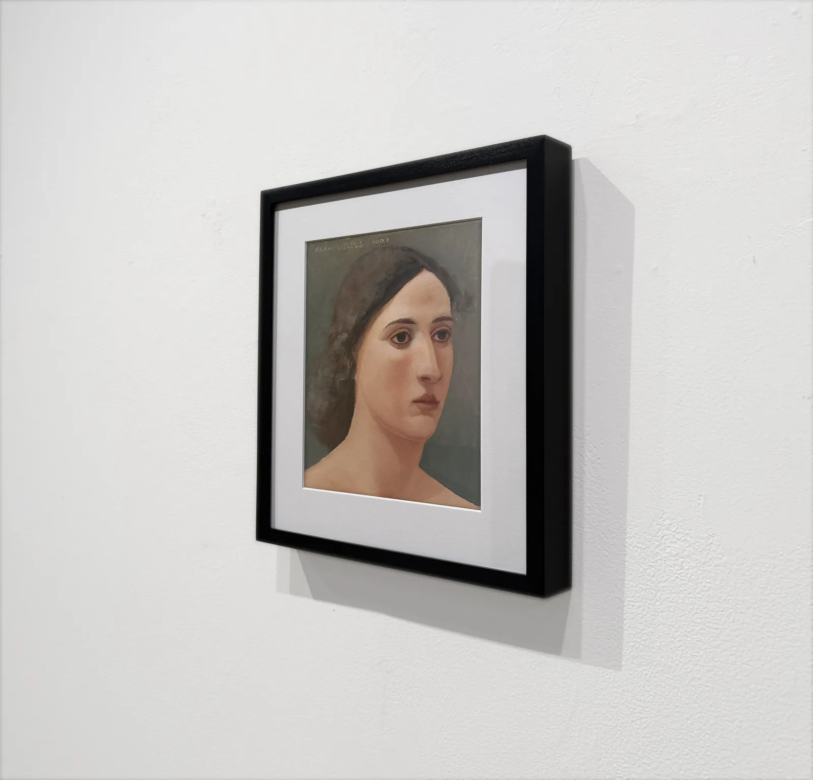 Female head portrait with dark hair and light skin