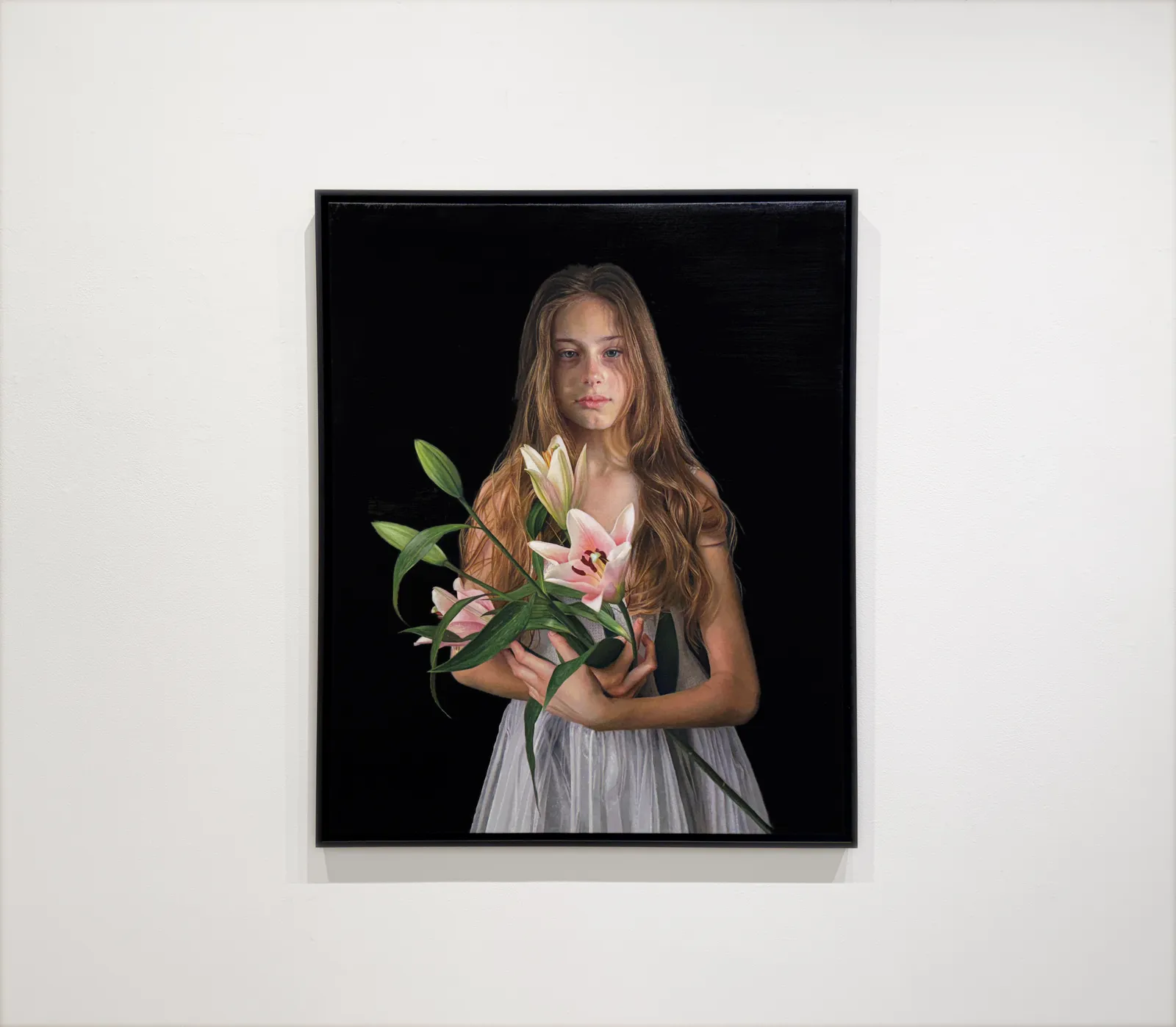 Portrait of a girl holding flowers