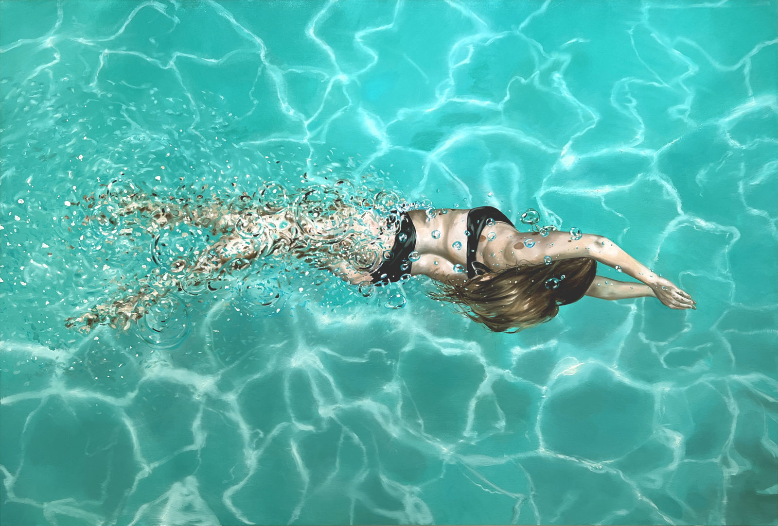 Woman in black bikini swimming in a pool