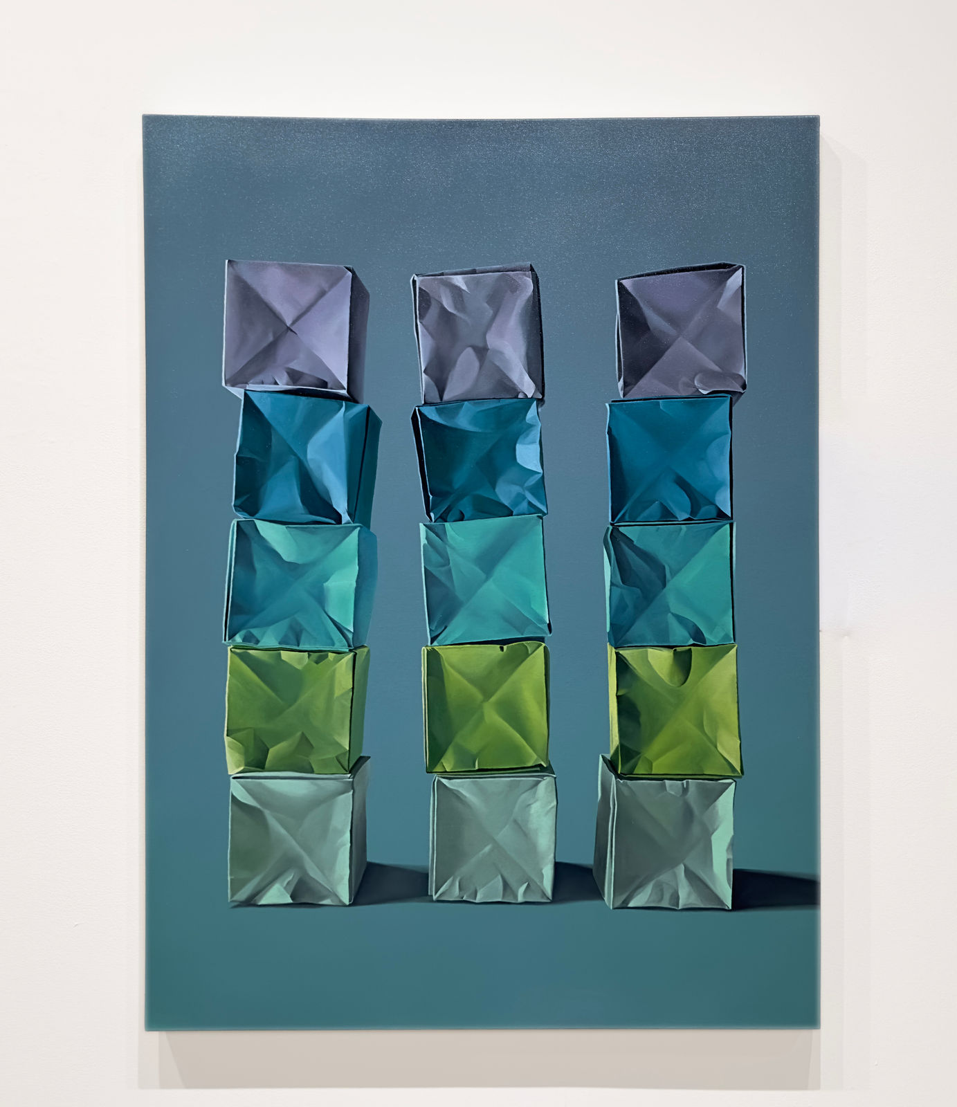 Painting of stacks of colorful paper origami boxes