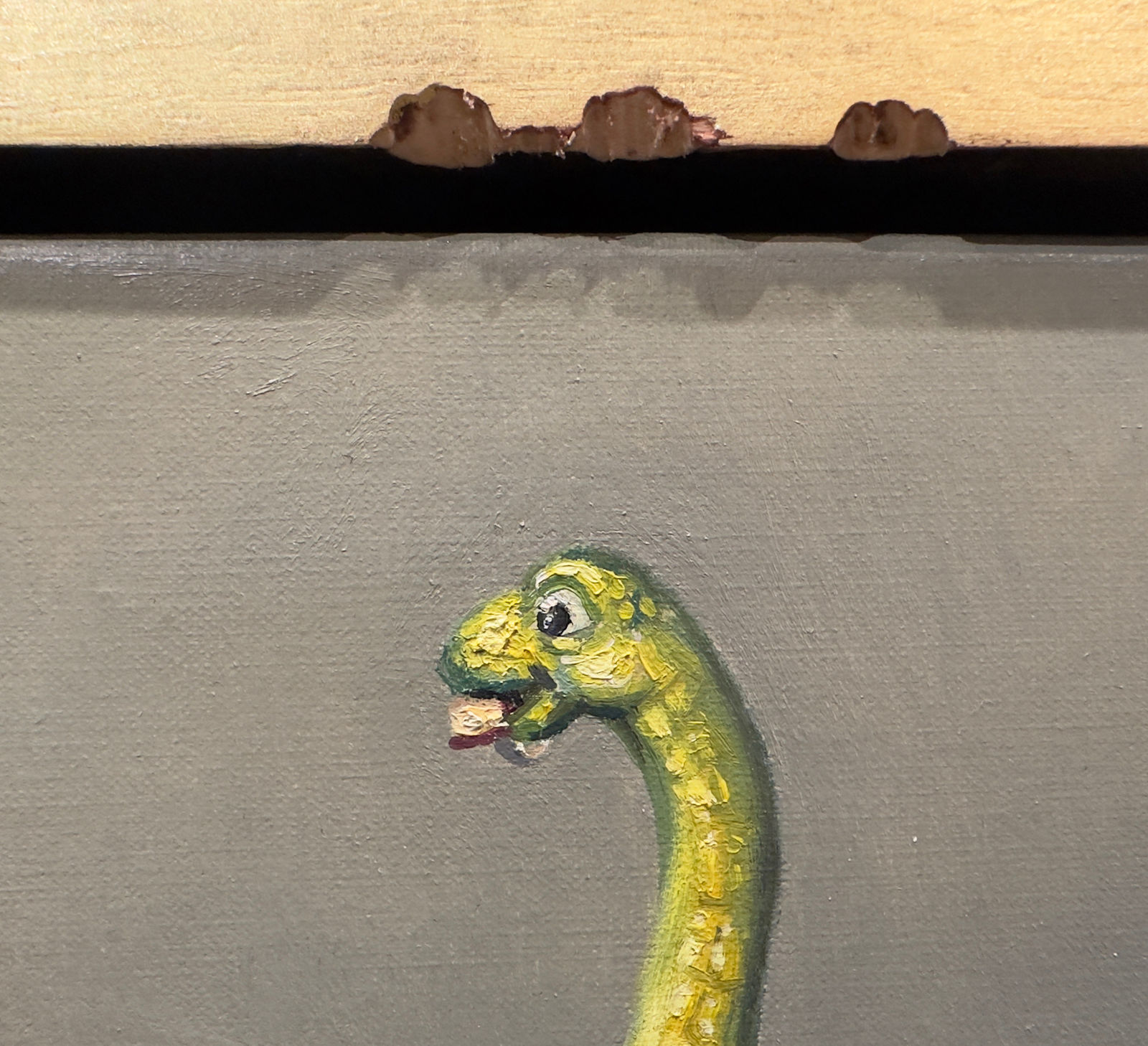 Painting of a dinosaur with a bit apple beside it, all surrounded by a bitten frame