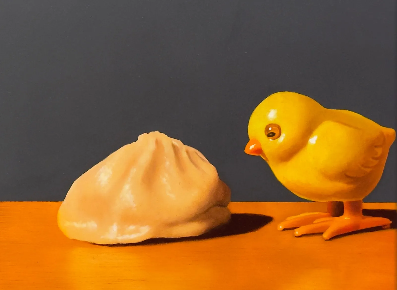 Painting of dumplings, a toy chick, and a letter block