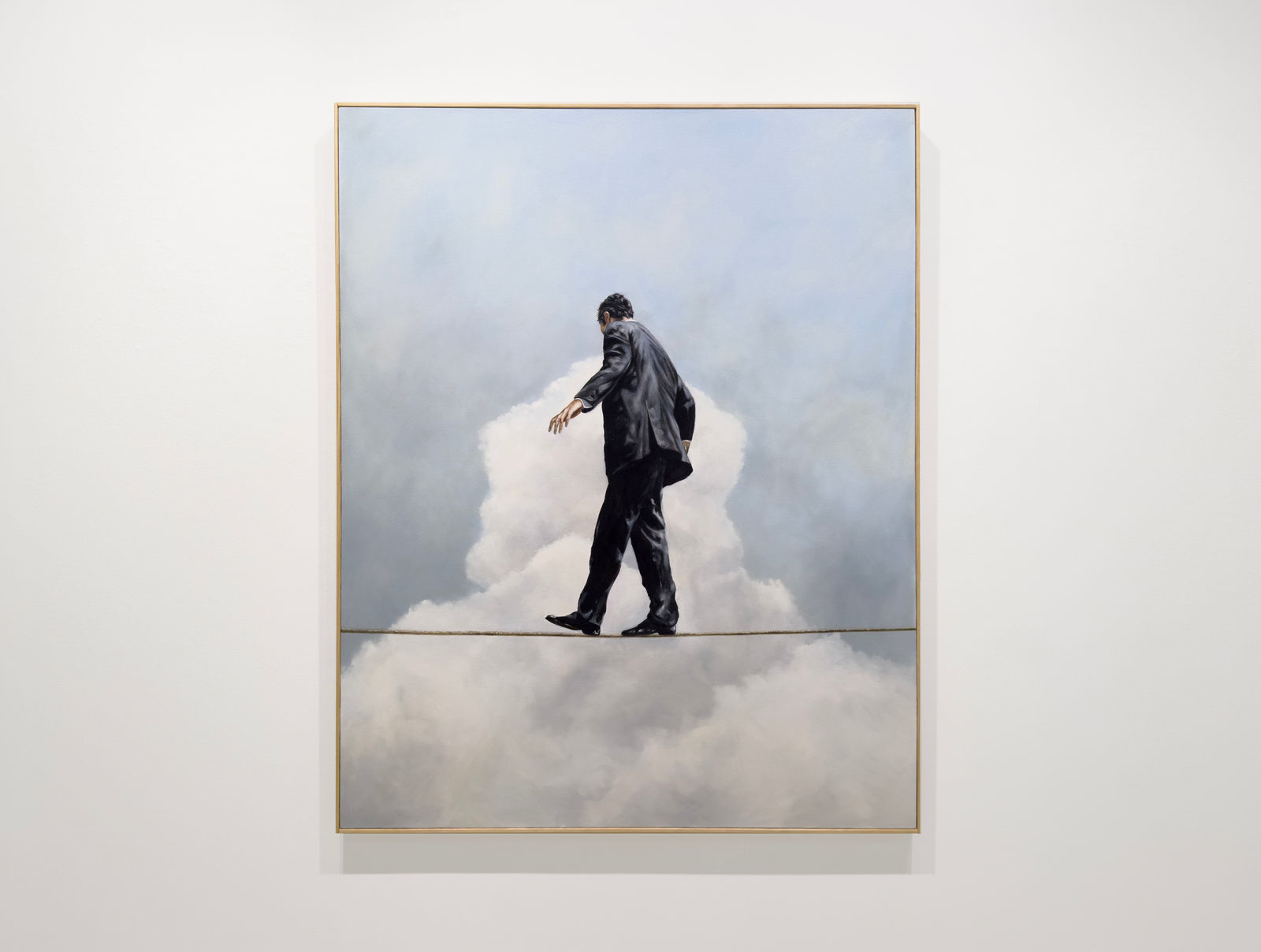 Man in business suit walking on a tightwire