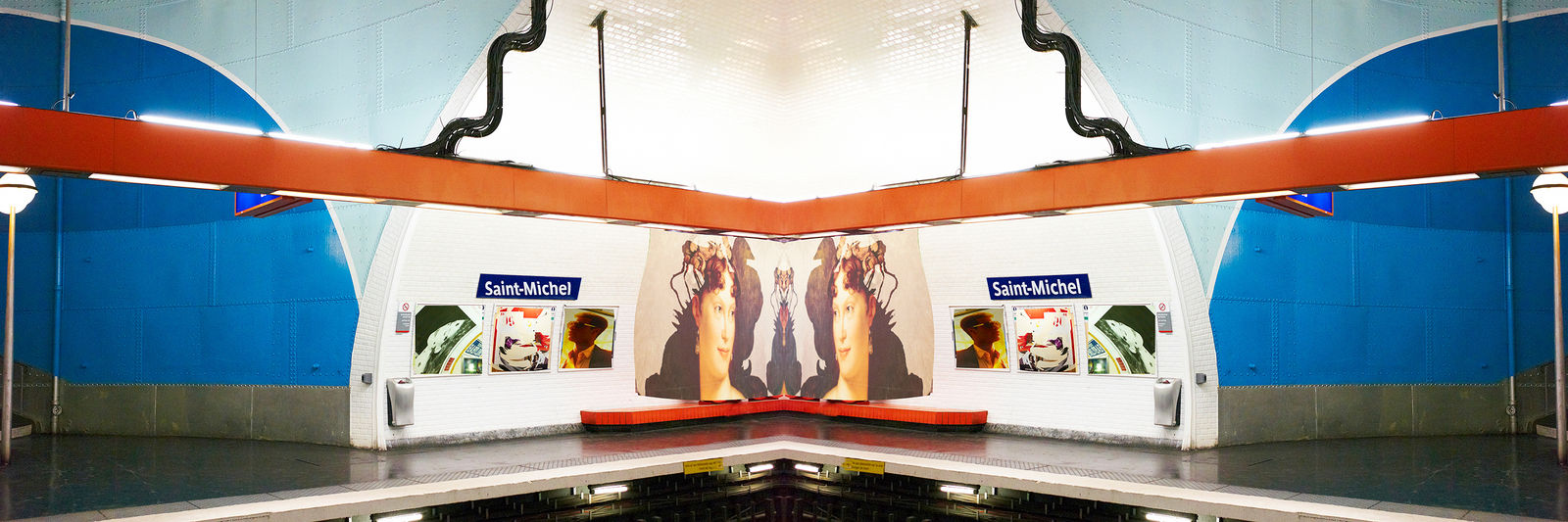 blue and red design in Saint-Michel subway by Laurie Victor Kay