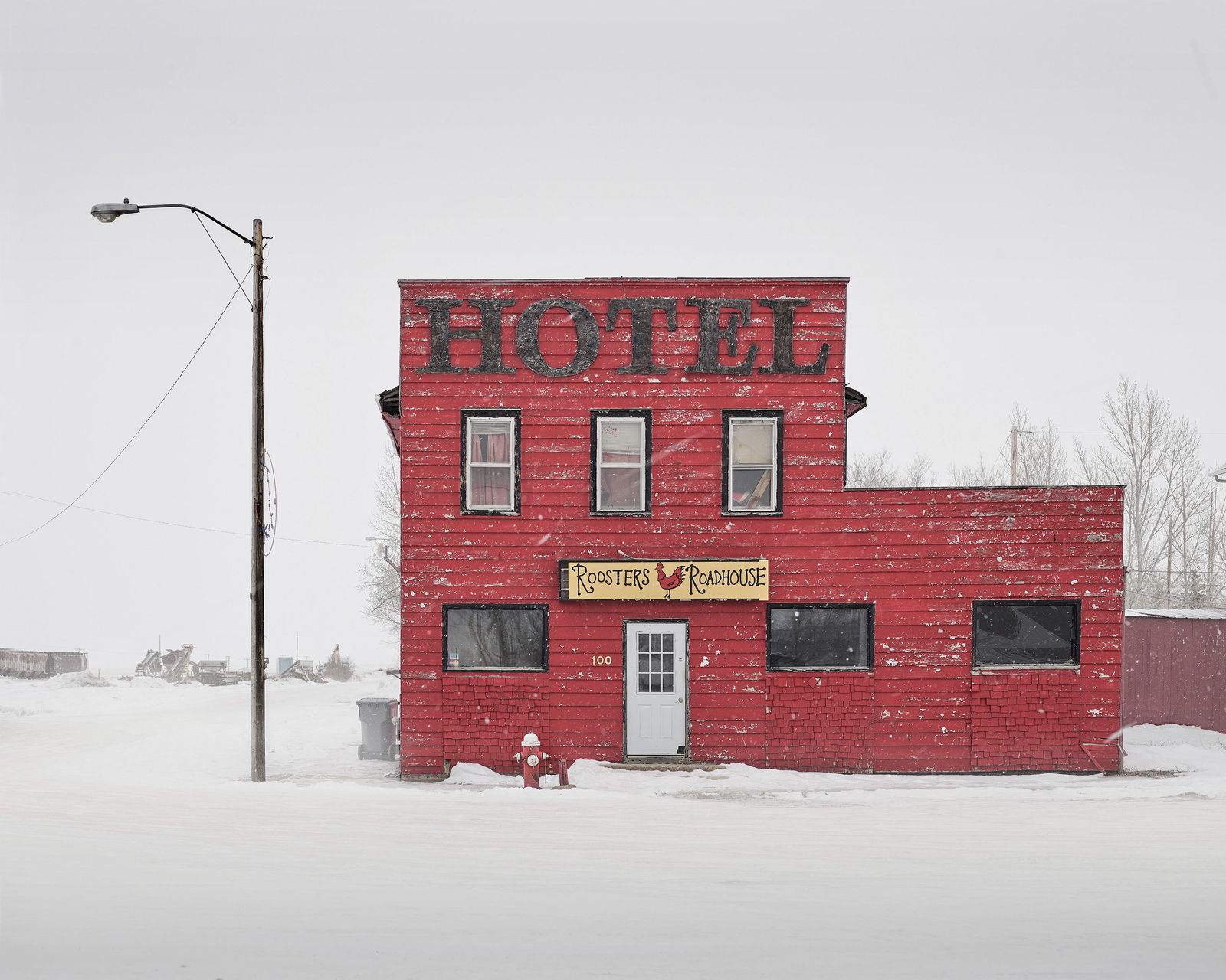 Red hotel in snow photograph