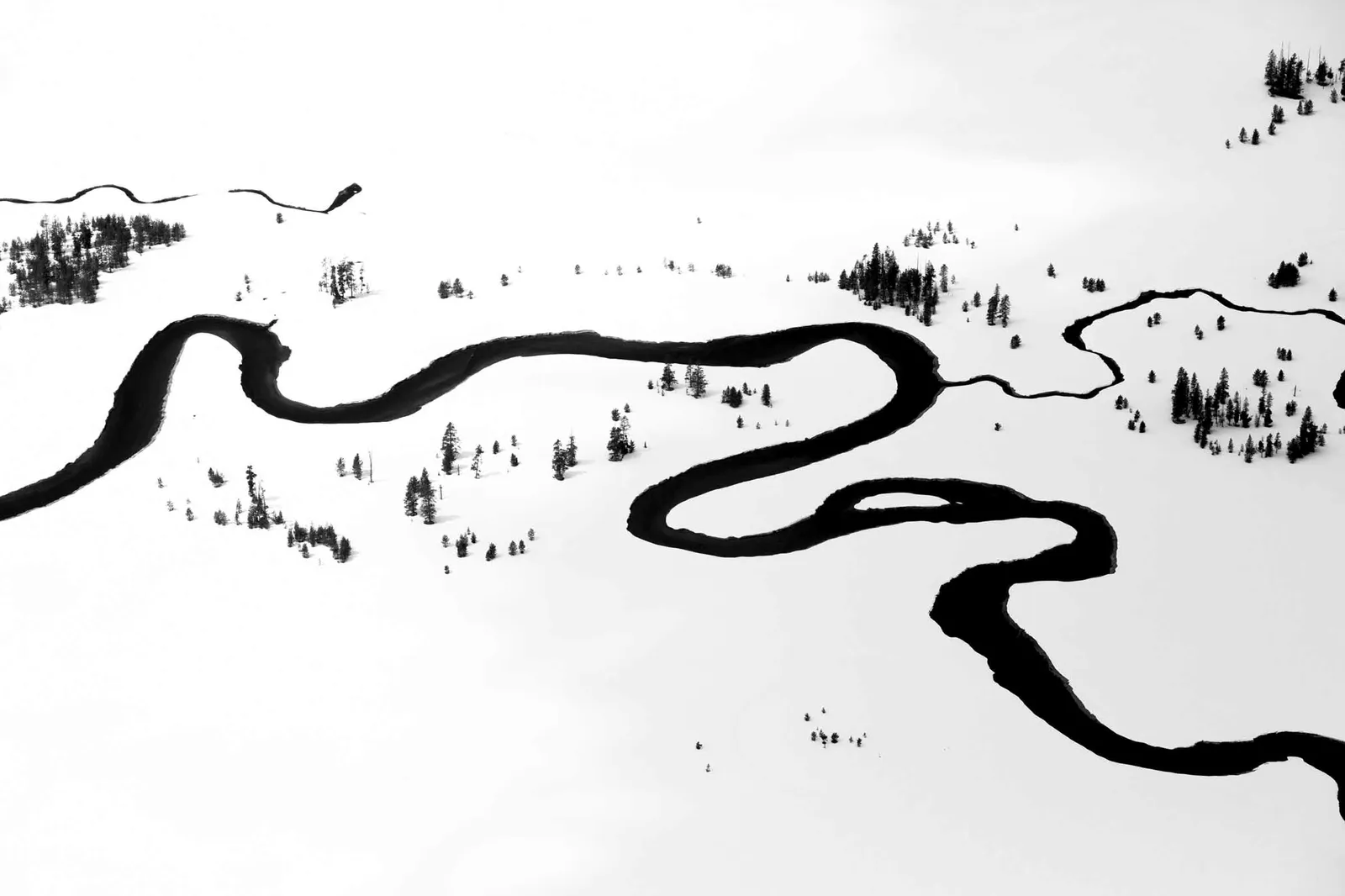 Jackson Hole artist Tuck Fauntleroy photographs aerial shots of rivers in wintertime original prints here Gilman Contemporary Sun Valley art gallery Idaho