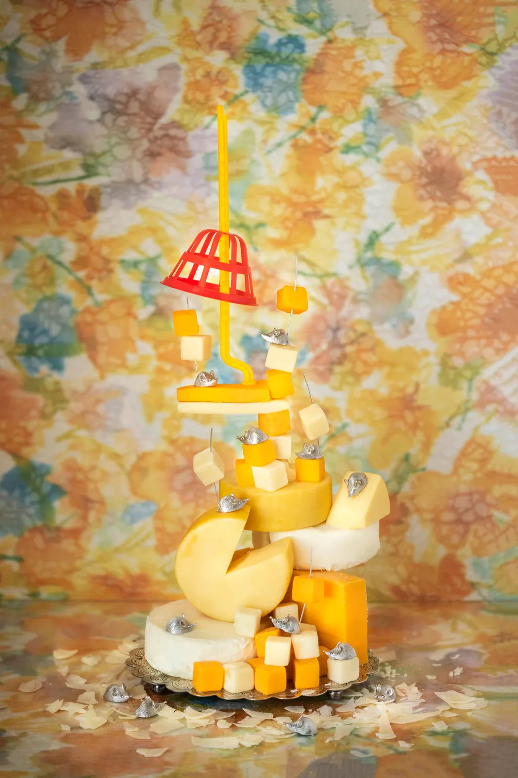 cheese with toy mouse trap on top by jp terlizzi