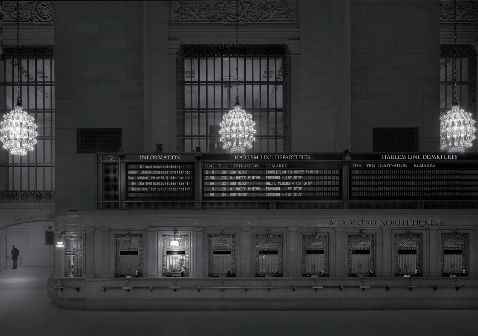 train ticket window at night grand central station by Michael massaia