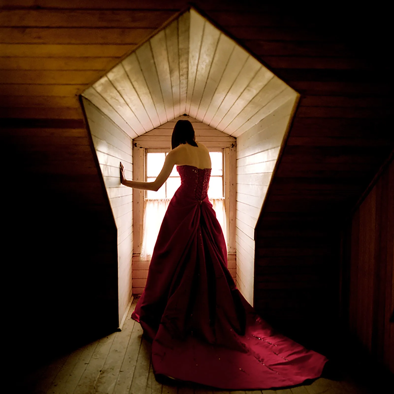 Rodney Smith color photograph woman in window wearing red dress looking out