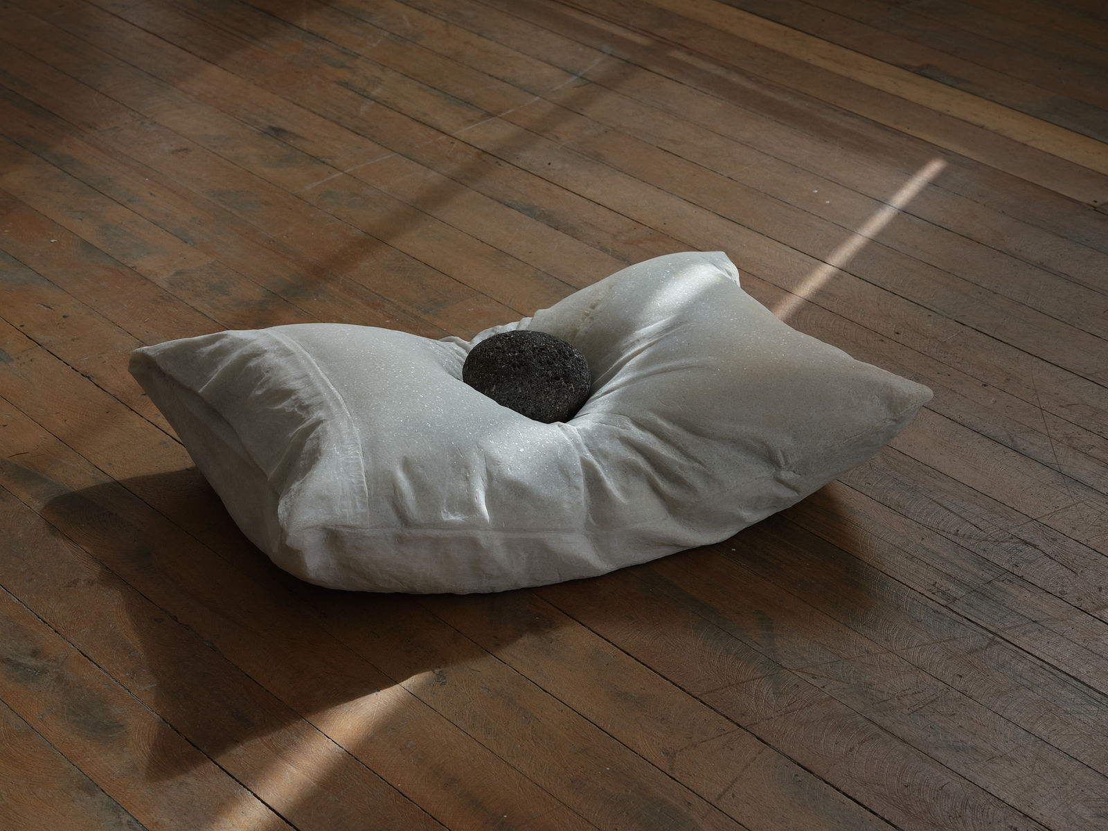 Steve Carr, A Pillow with a River Rock, 2022