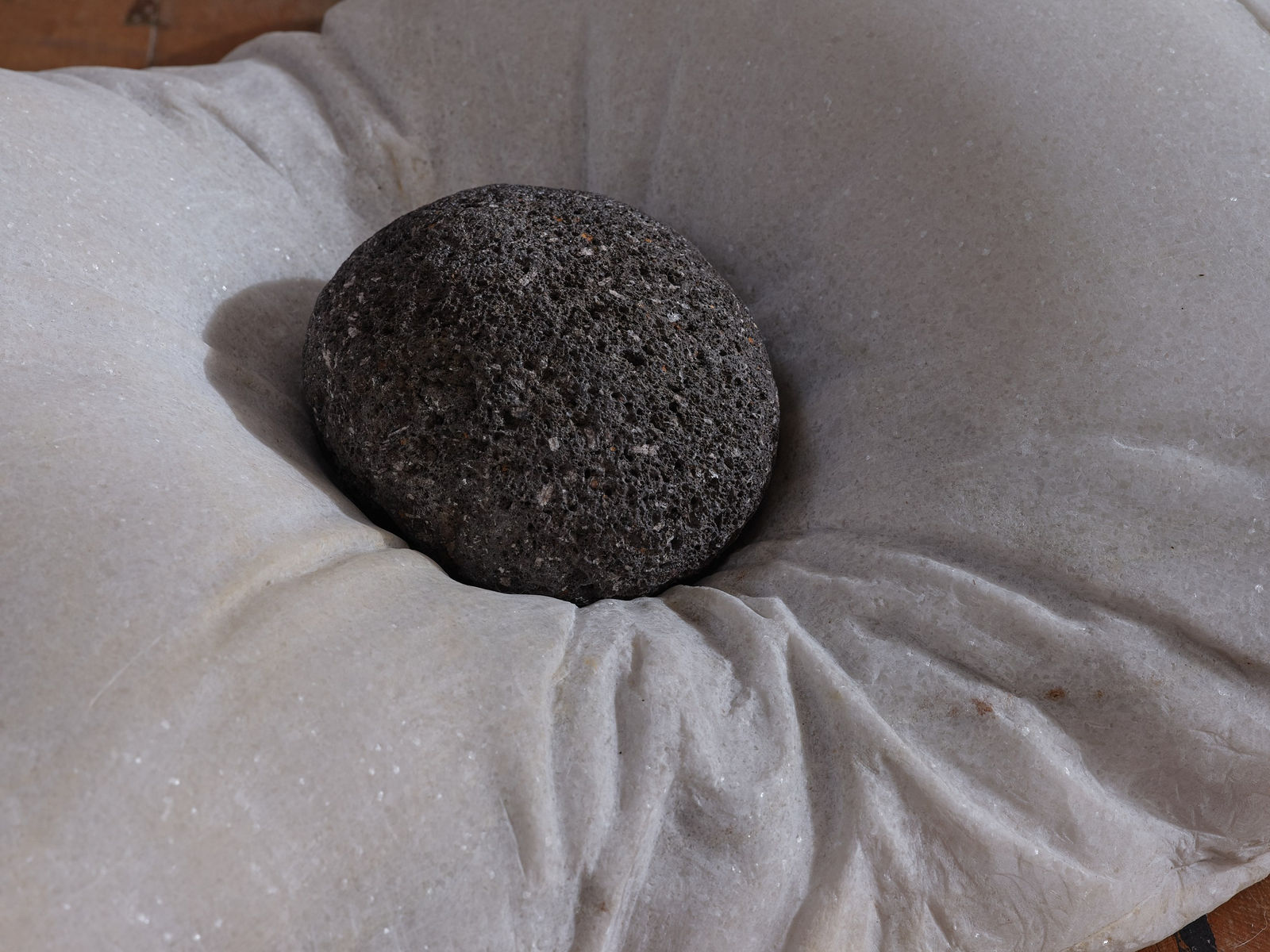 Steve Carr, A Pillow with a River Rock, 2022