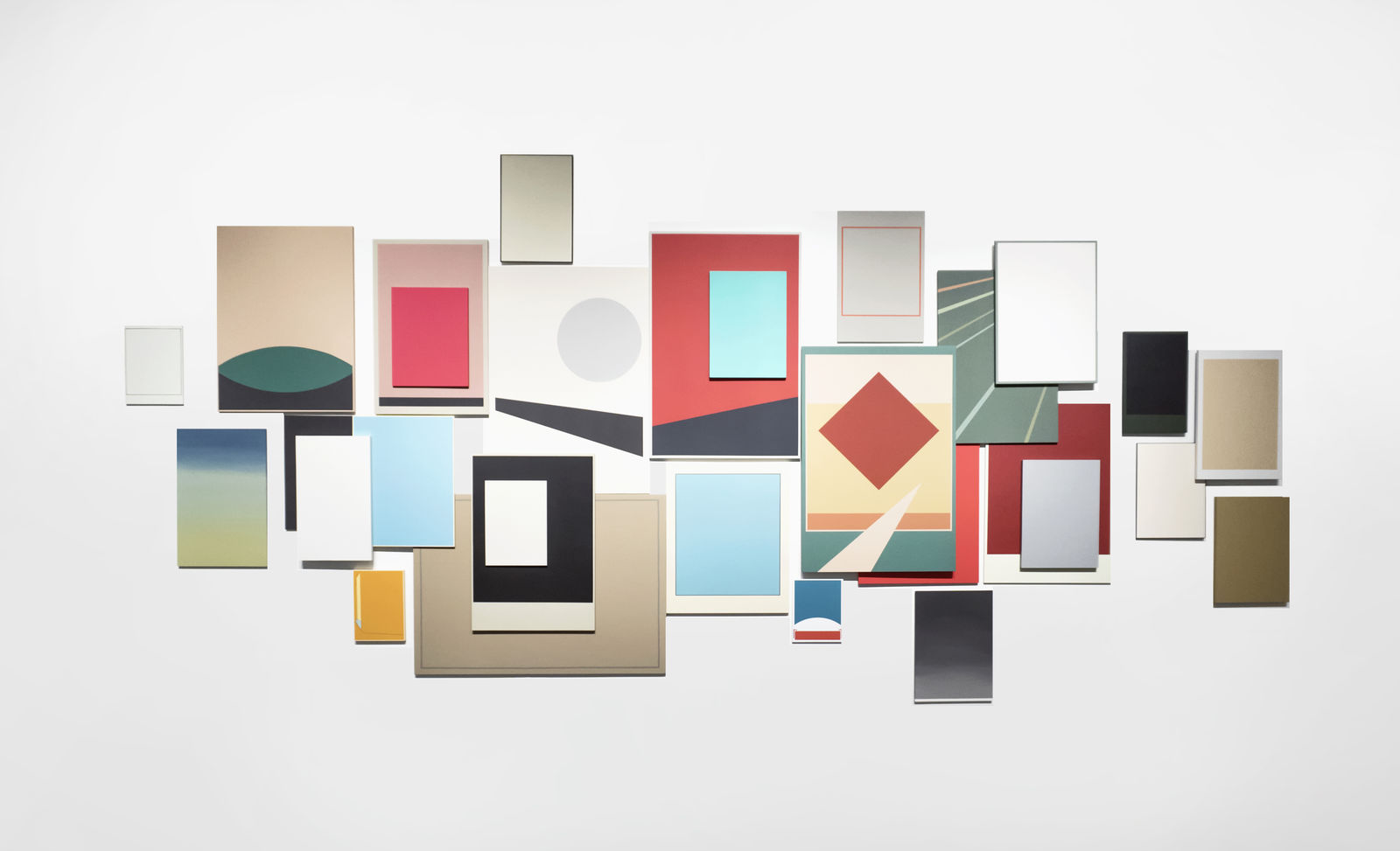 A series of multicolored pieces arranged on a white wall