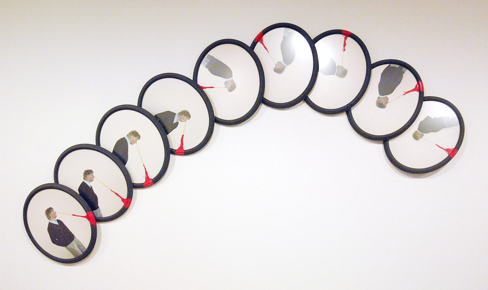 A series of colored photographs framed in circular shaped frames.