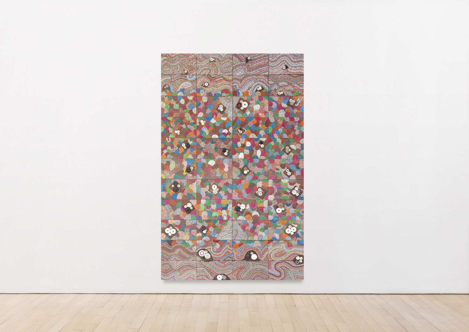 mixed media work featuring reclaimed electronic components on panel featuring an explosive array of swirling and spotted colors