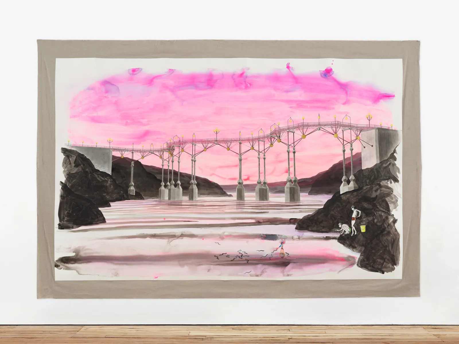 A big, mixed media drawing of boys fishing beneath a bridge with pink sky, mounted on linen and hung on the gallery wall.