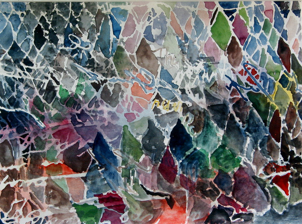 Pattern of loose multicolored diamond shapes outlined in white.