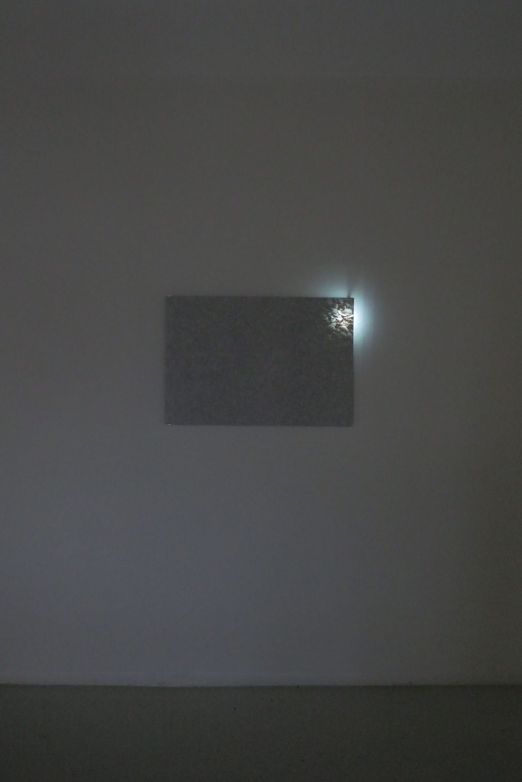 An image of the piece with a small burst of light showing sea shells in the right corner of piece.