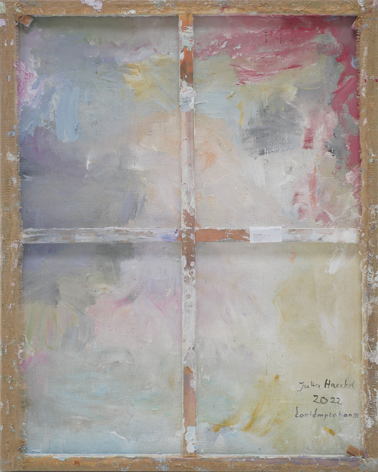 Multicolored paint spread across the back of a canvas. Signed, dated, titled in black.