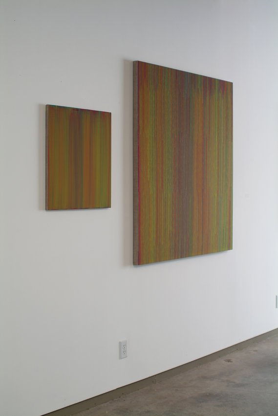 Two dark, dripping red yellow orange and purple panels follow the same pattern The panel to the right is a large rendition of the dripping pattern while the one on the left is a smaller copy