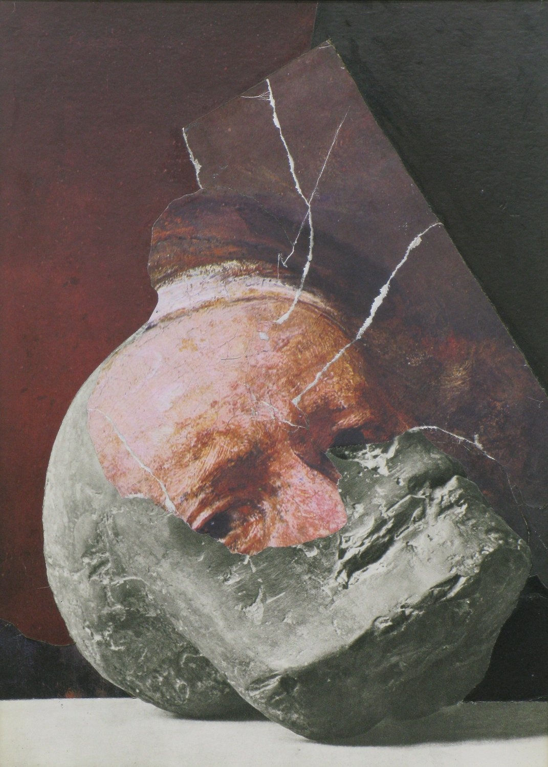 Object resting on a white countertop is part-rock sculpture and part-self portrait of Rembrandt.