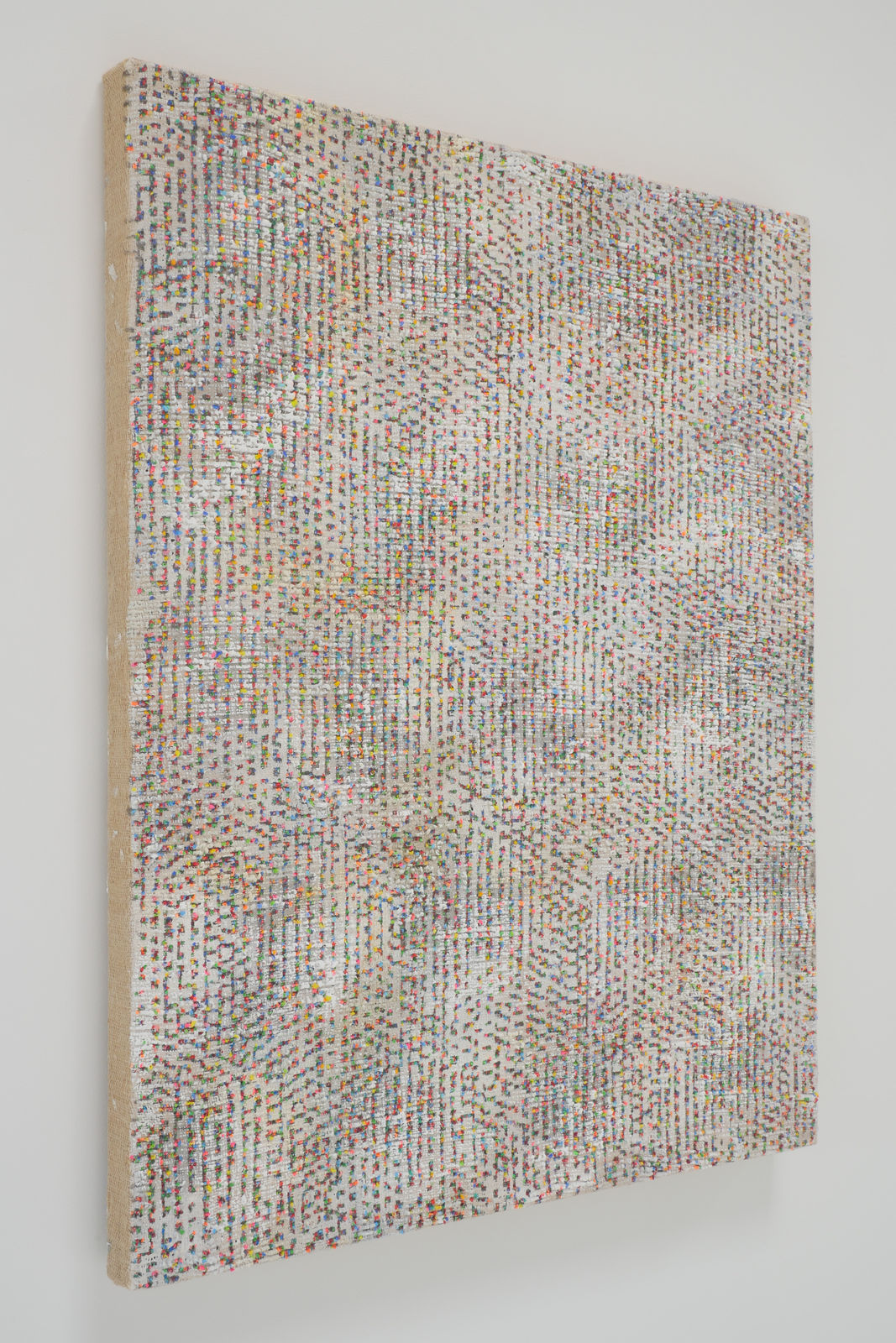 Side view of a multicolored abstract painting.