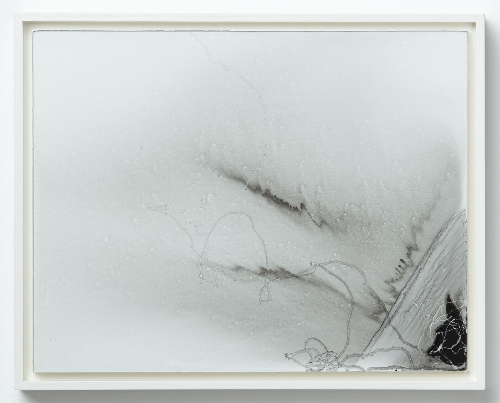 Gray ink wash with darker overlapping ink trails concentrated at bottom right corner. A small black ink puddle is at the bottom right corner