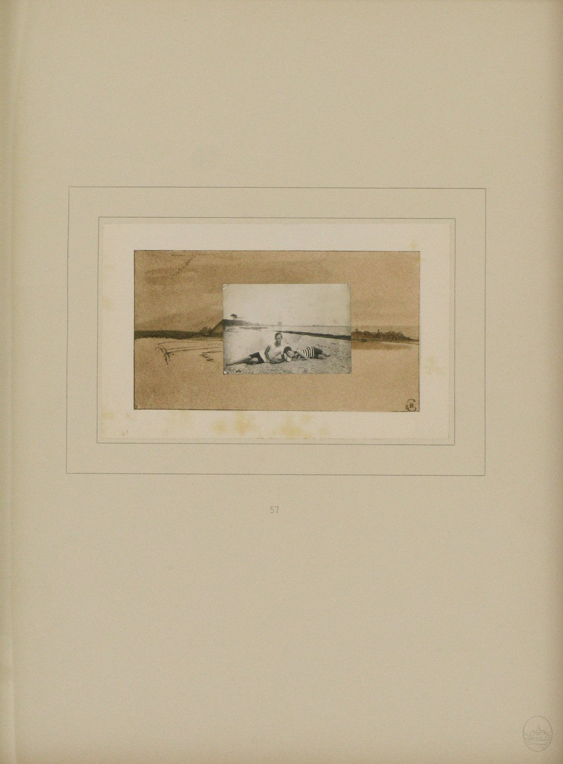 Black and white photo of two people laying on the beach is layered over a drawing of a body of water with land on the horizon.