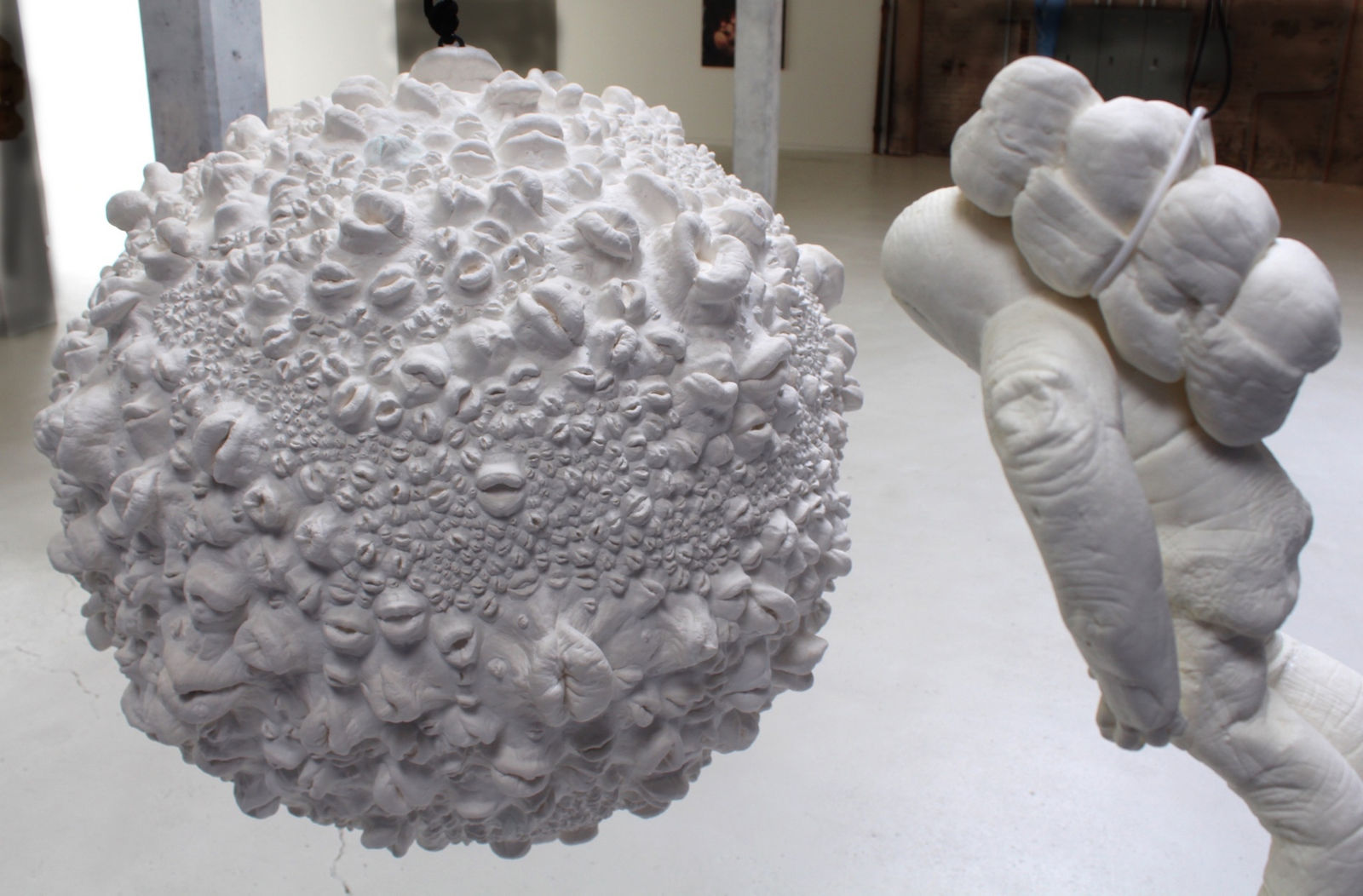 Detail view of astronaut facing moon.