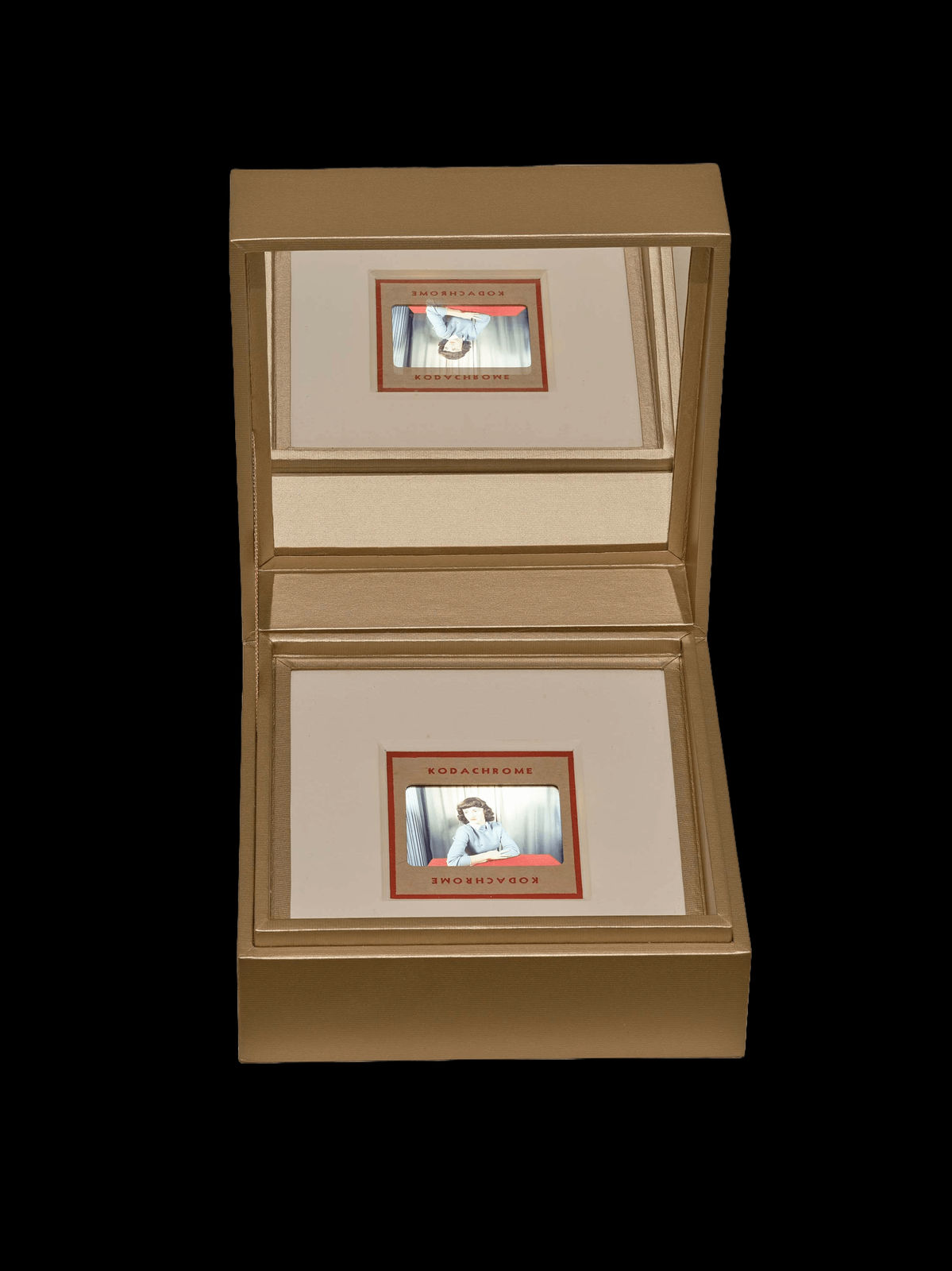 Vintage slide of lady in blue sweater in golden mirrored jewelbox by Lee Shulman and the Anonymous Project