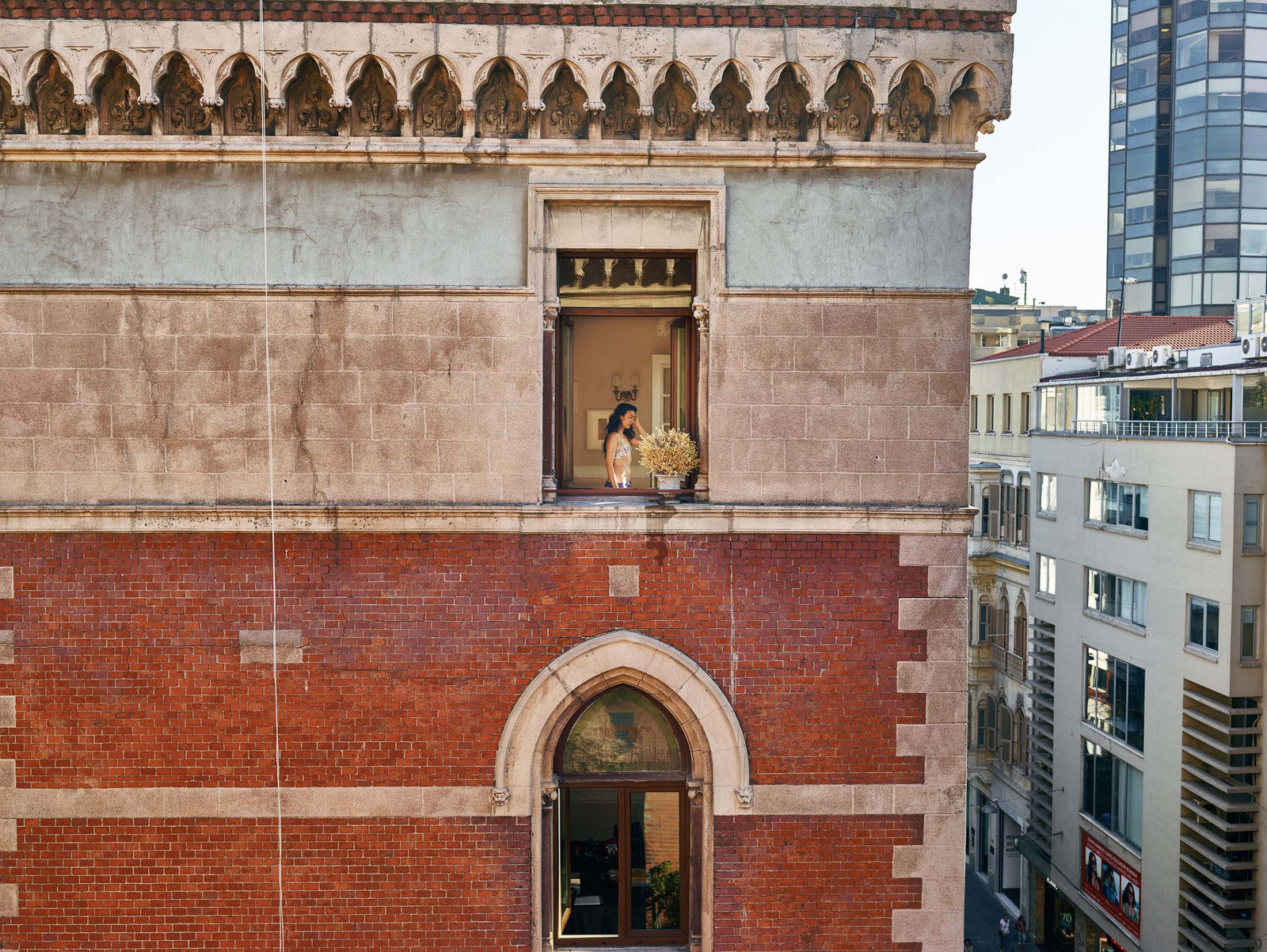 Gail Albert Halaban Out My Window Istanbul Berfin, Istiklal Cad, Beyoğlu, September 2 woman in bra in window