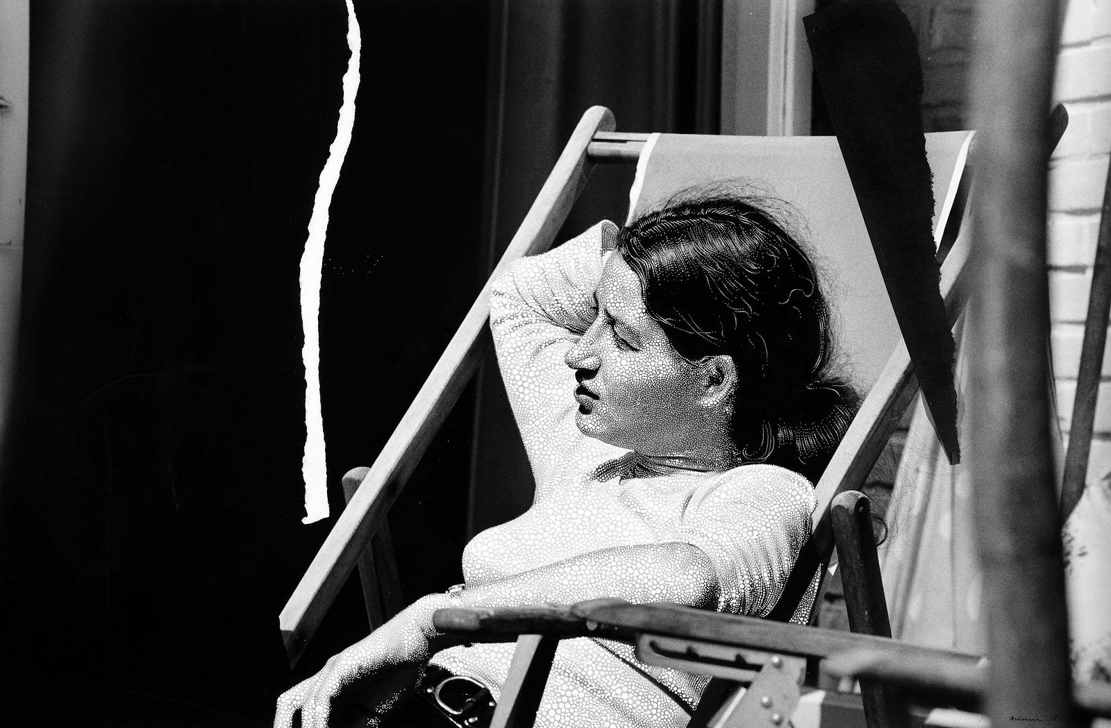 Sebastiaan Bremer Veronica Seasons black and white image of woman seated in deck chair with painted dots and ripped paper