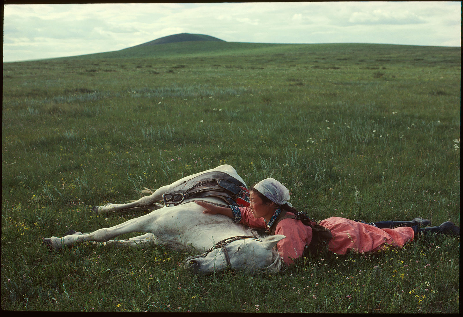 Eve Arnold, A woman trains a horse for the militia in Inner Mongolia, China, 1979