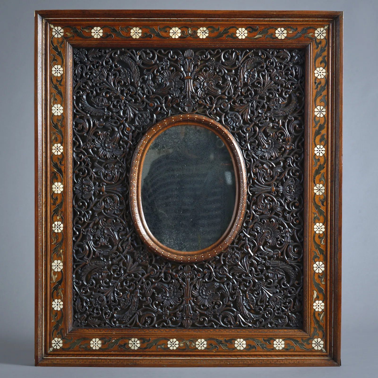 ANGLO-INDIAN CARVED TEAK MIRROR INLAID WITH BONE AND BUFFALO HORN