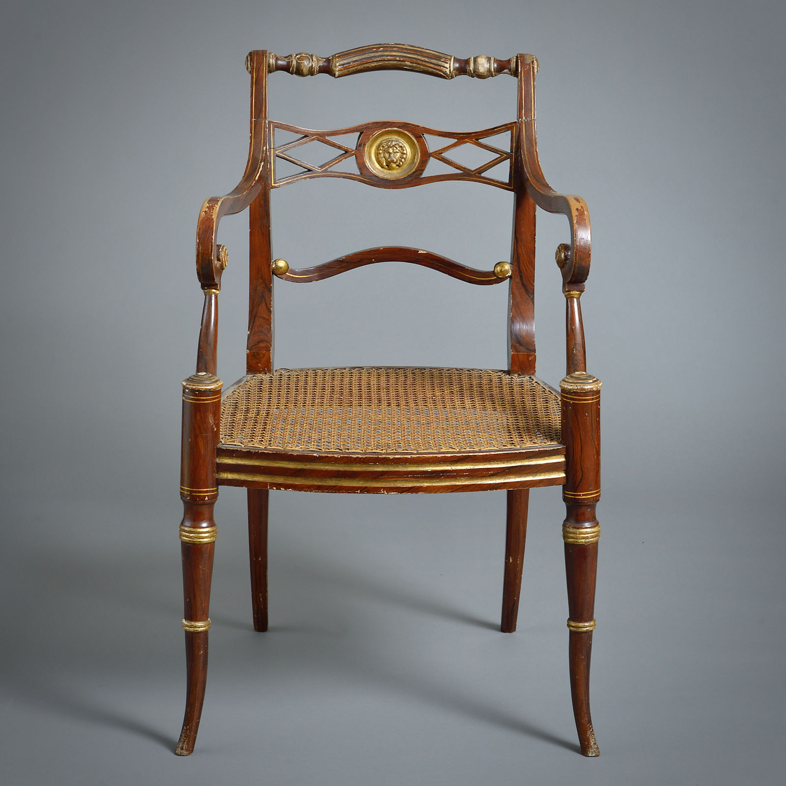 PAIR OF REGENCY GRAINED AND PARCEL-GILT OPEN ARMCHAIRS