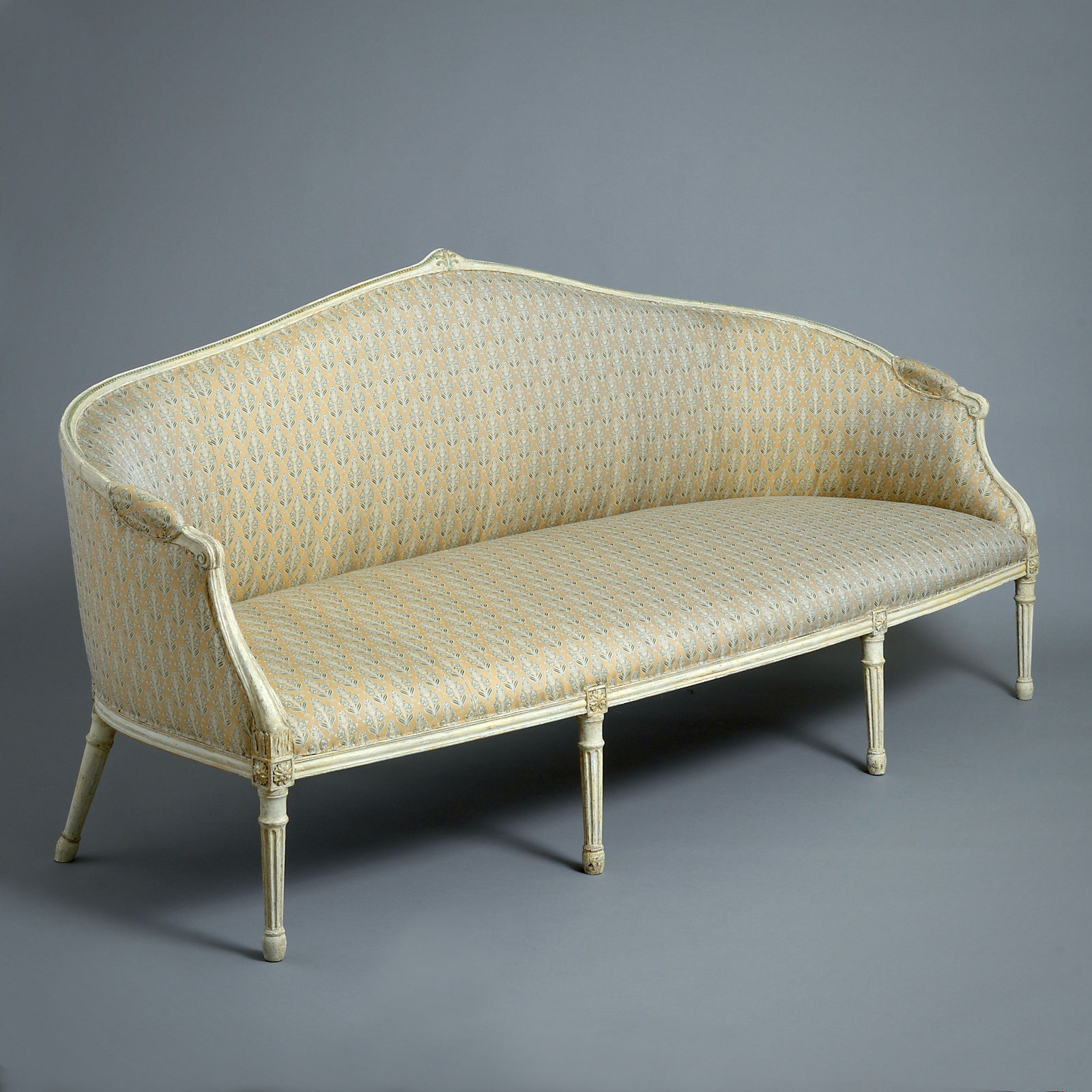 PAIR OF GEORGE III GREEN AND WHITE PAINTED SOFAS ATTRIBUTED TO JOHN LINNELL