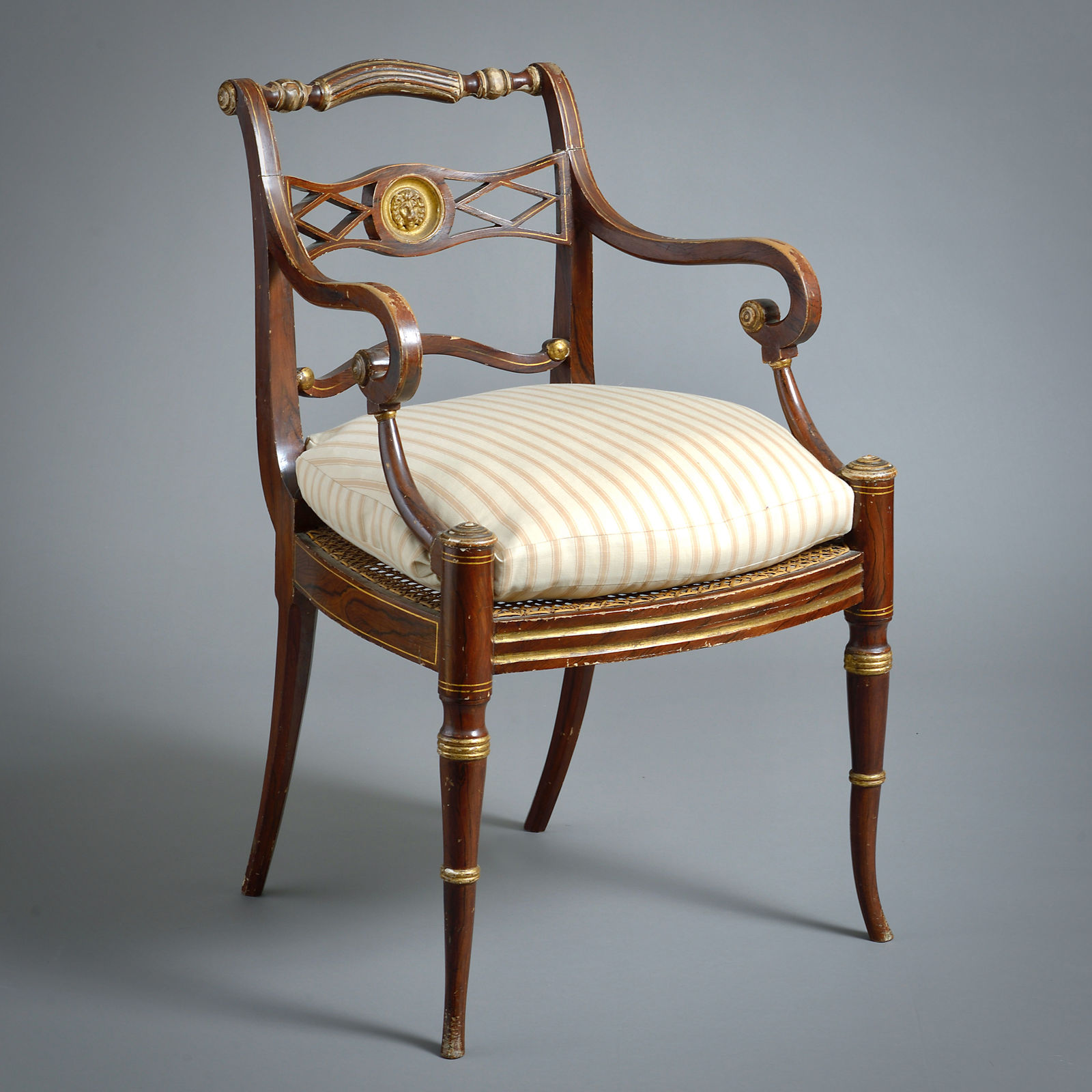 PAIR OF REGENCY GRAINED AND PARCEL-GILT OPEN ARMCHAIRS