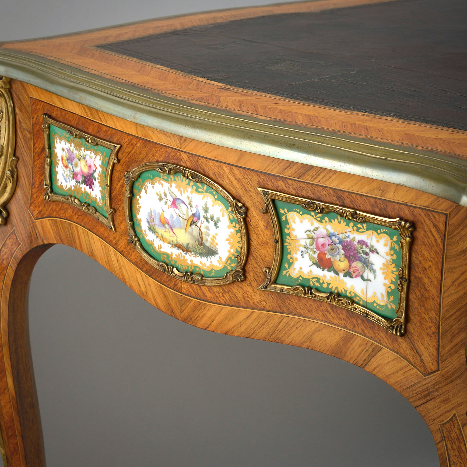 EARLY VICTORIAN PORCELAIN AND ORMOLU-MOUNTED KINGWOOD BUREAU-PLAT