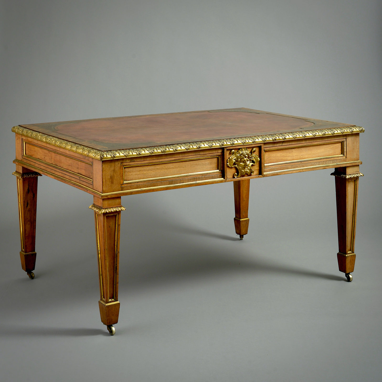 REGENCY ORMOLU-MOUNTED ROSEWOOD WRITING TABLE BY LOUIS LE GAIGNEUR