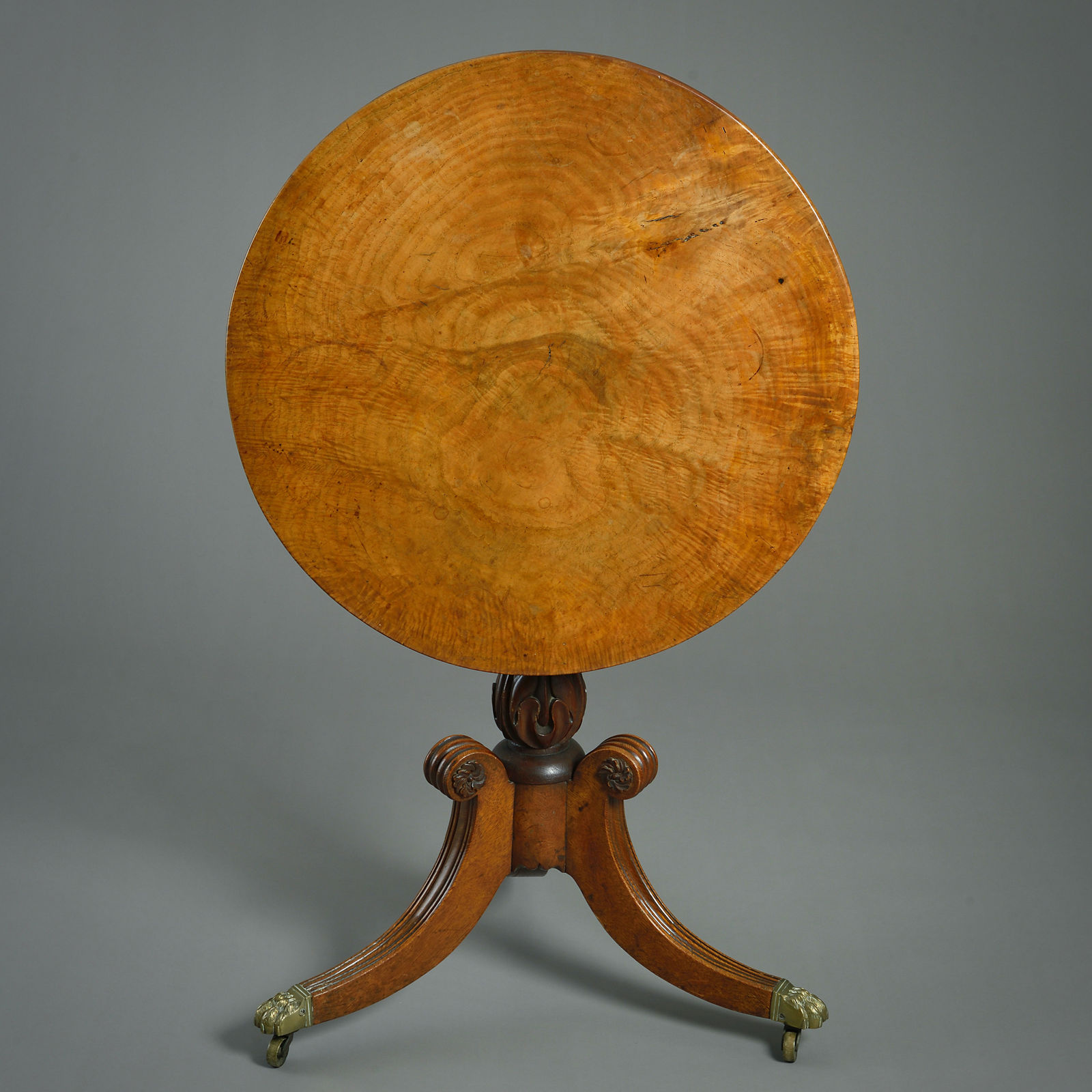 REGENCY AMBOYNA AND OAK TILT-TOP CENTRE TABLE
