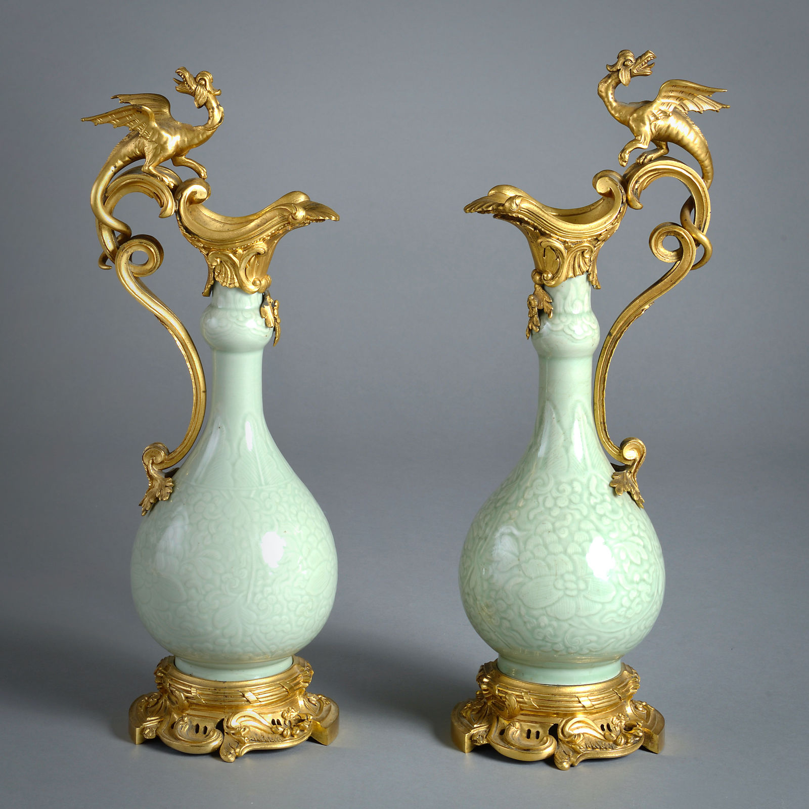 PAIR OF ORMOLU-MOUNTED CELADON EWERS ATTRIBUTED TO EDWARD HOLMES BALDOCK