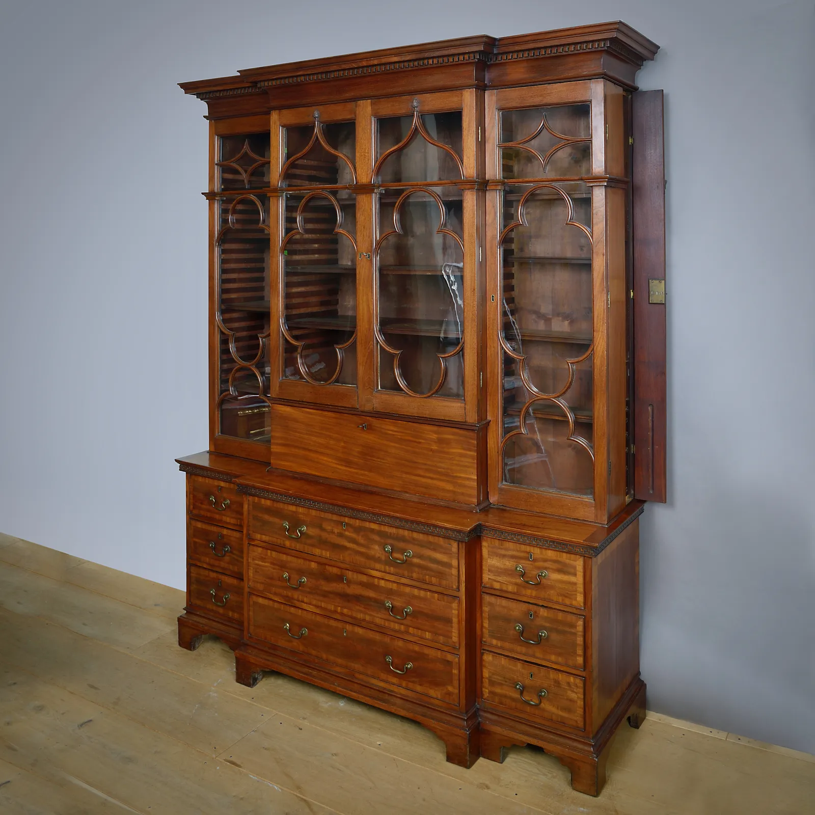 GEORGE III GOTHIC MAHOGANY BREAK-FRONT BOOKCASE