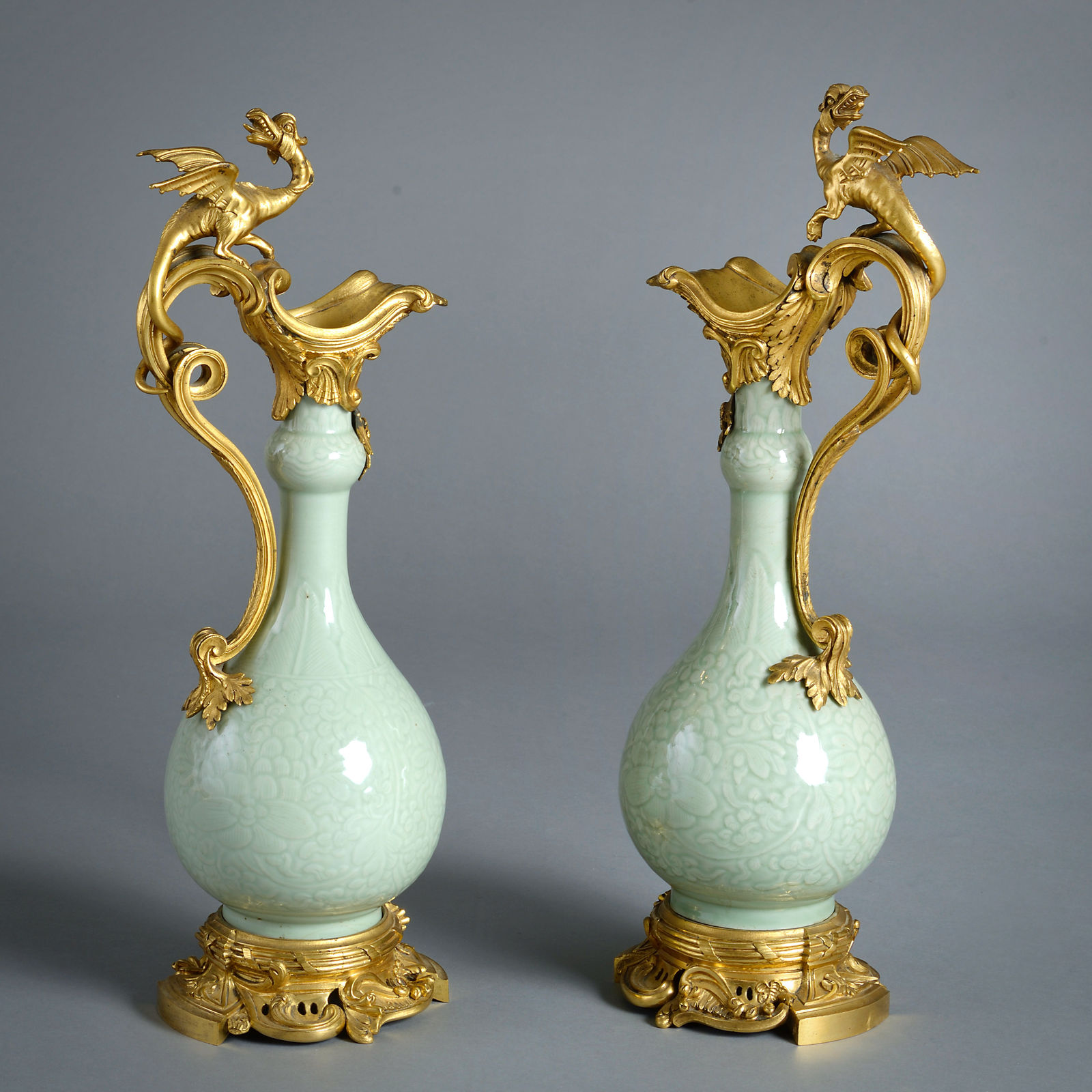 PAIR OF ORMOLU-MOUNTED CELADON EWERS ATTRIBUTED TO EDWARD HOLMES BALDOCK