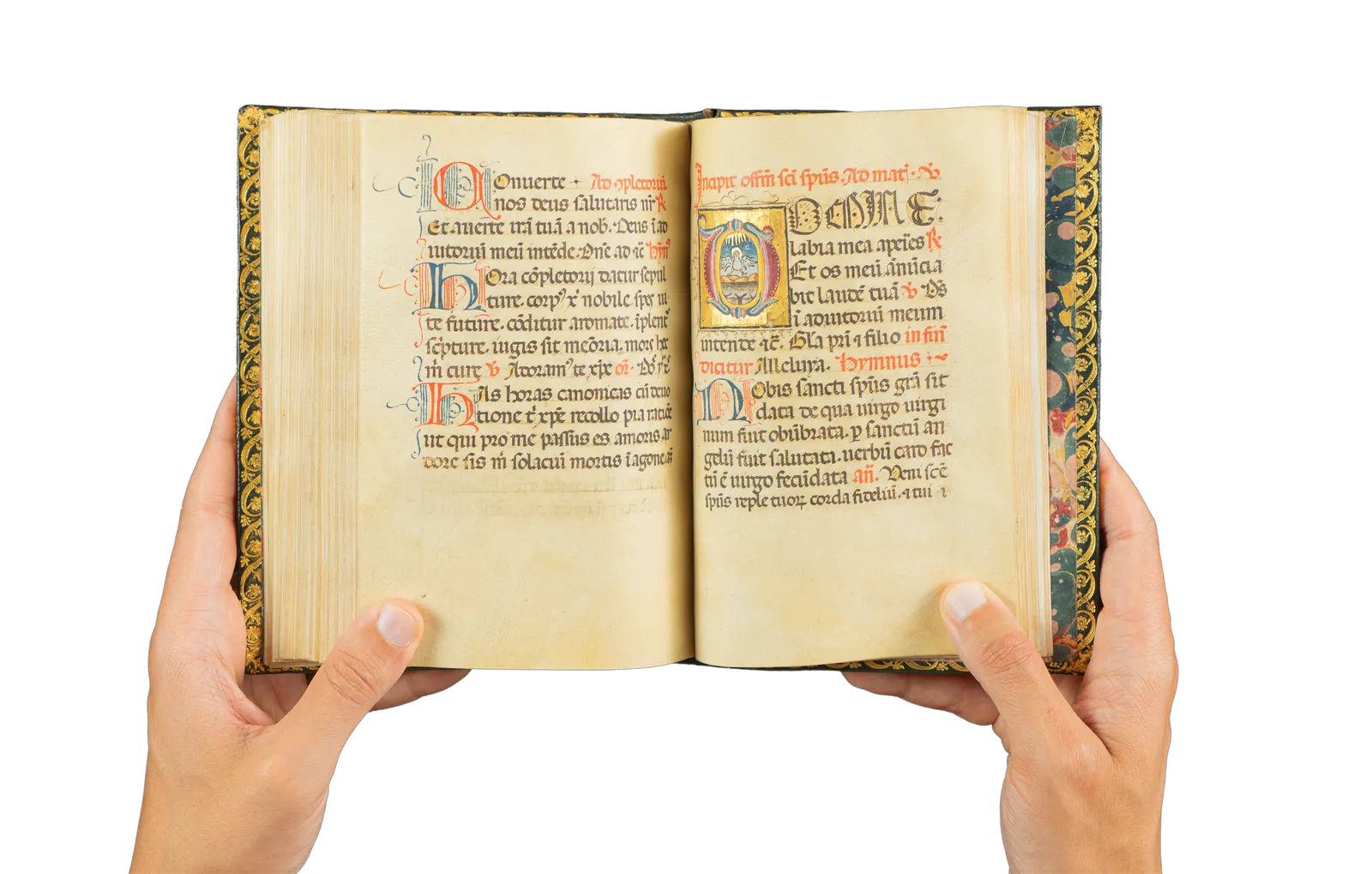 A richly illuminated medieval manuscript, Italian Book of Hours from Rome, signed and dated by the scribe, with many illuminations and decorative borders, with the page showing the holy dove